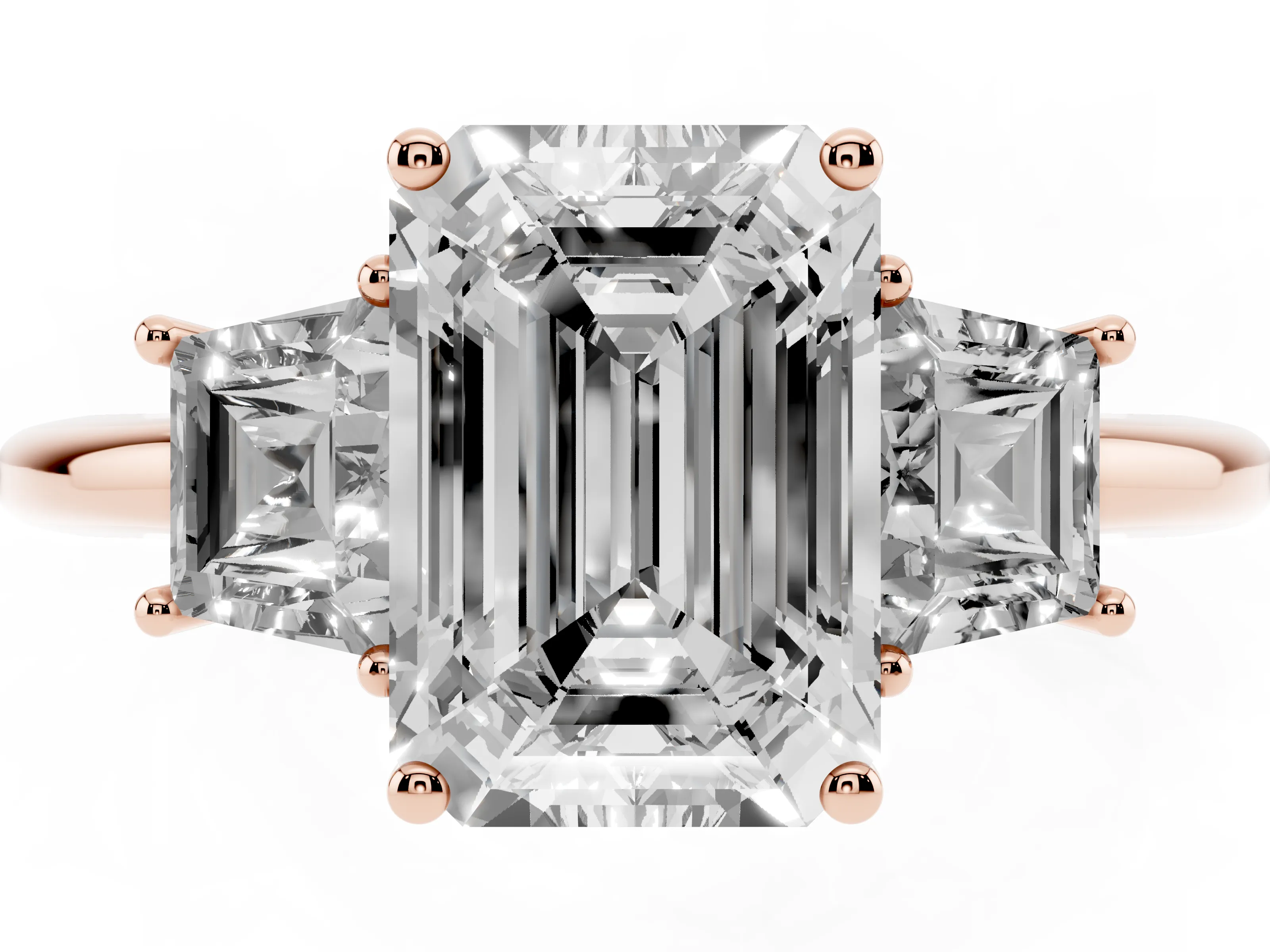 Emerald Cut Diamond Three-Stone Ring Set in Rose gold with Trapezoid Side Stones and Prong Setting