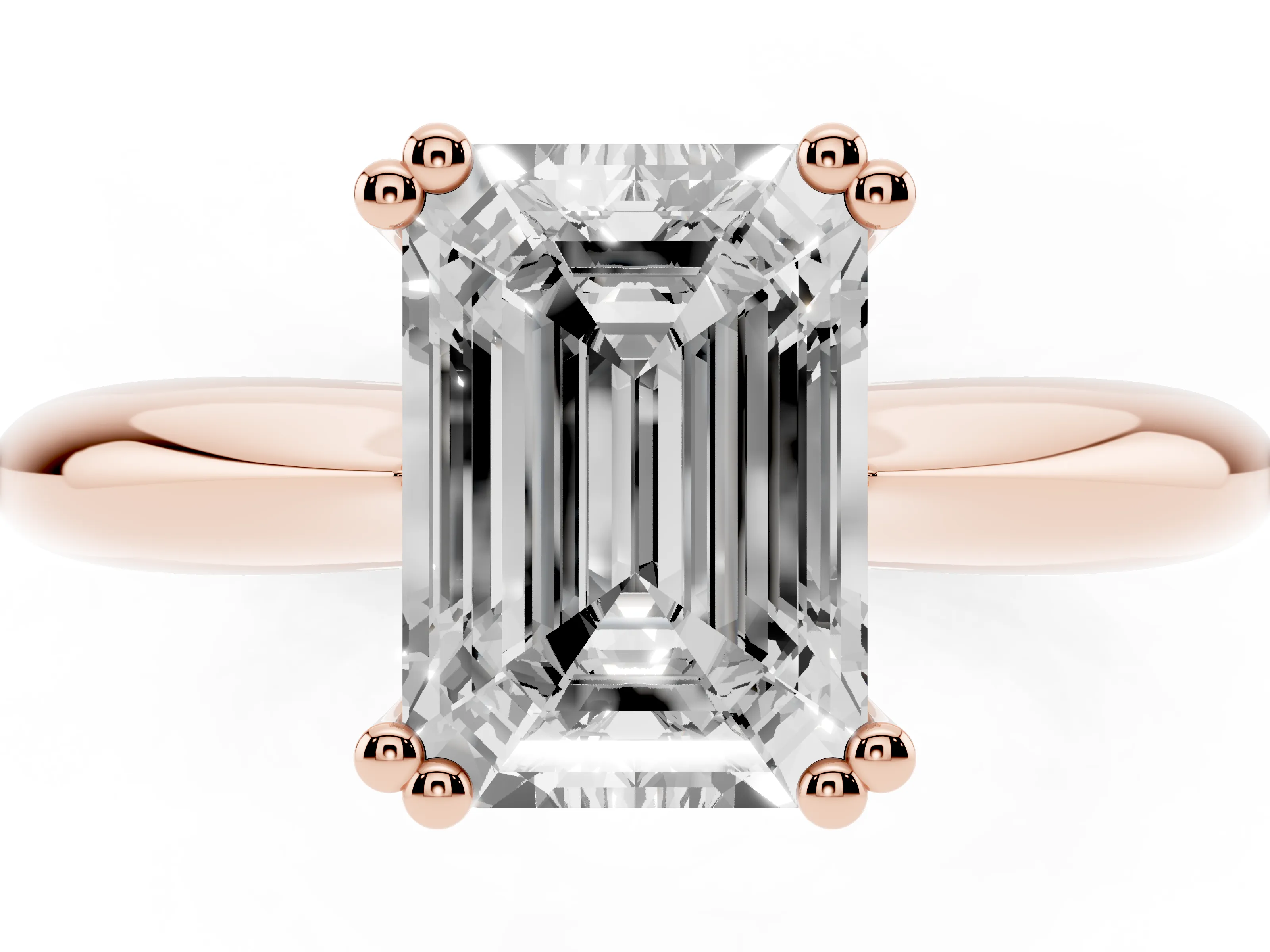 Emerald Cut Diamond Solitaire Engagement Ring Set in Rose gold with Tapered Band and Prong Setting