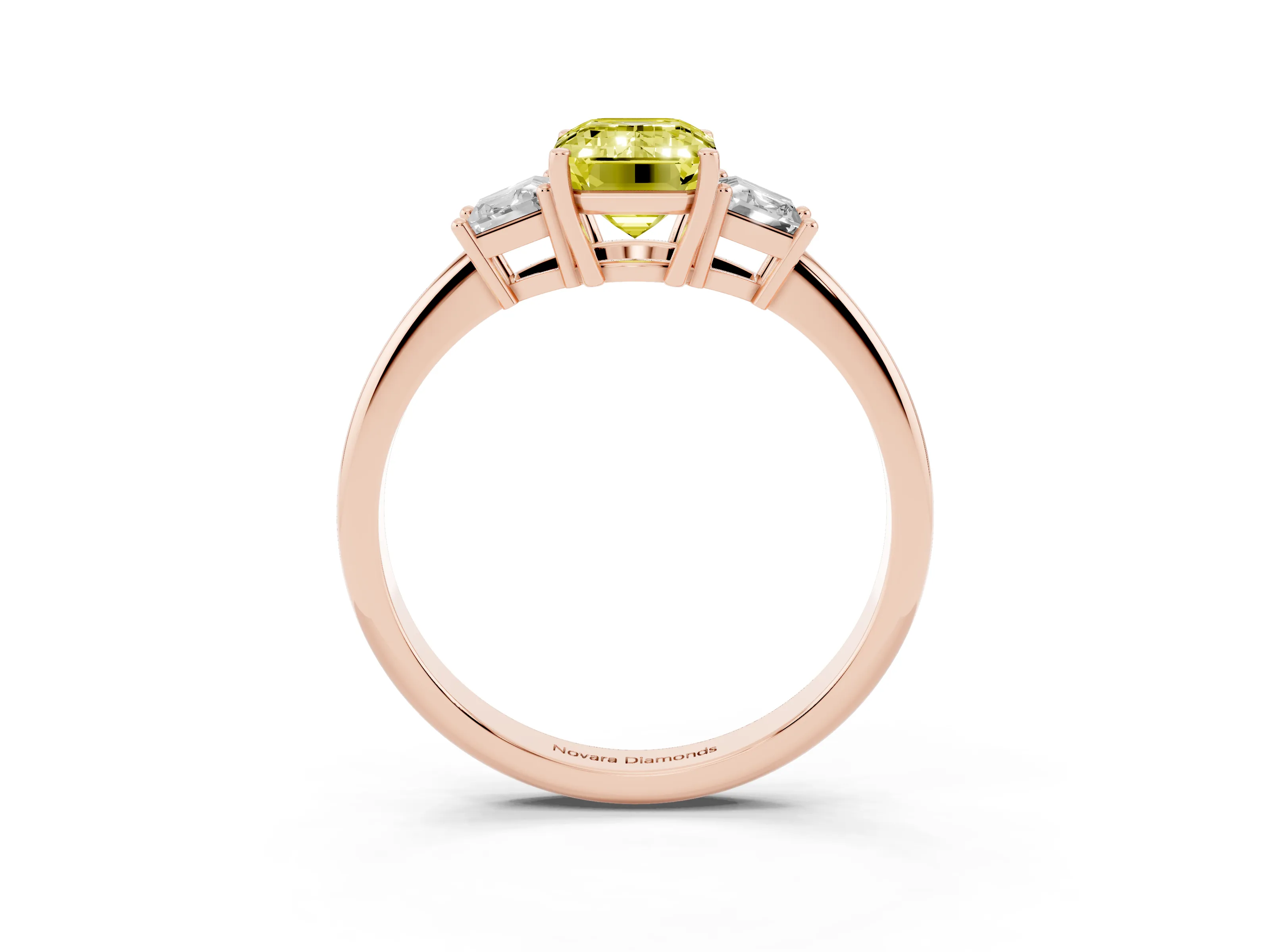 Fancy Yellow Emerald Cut Diamond Three-Stone Ring Set in Rose gold with Trapezoid Side Stones and Prong Setting