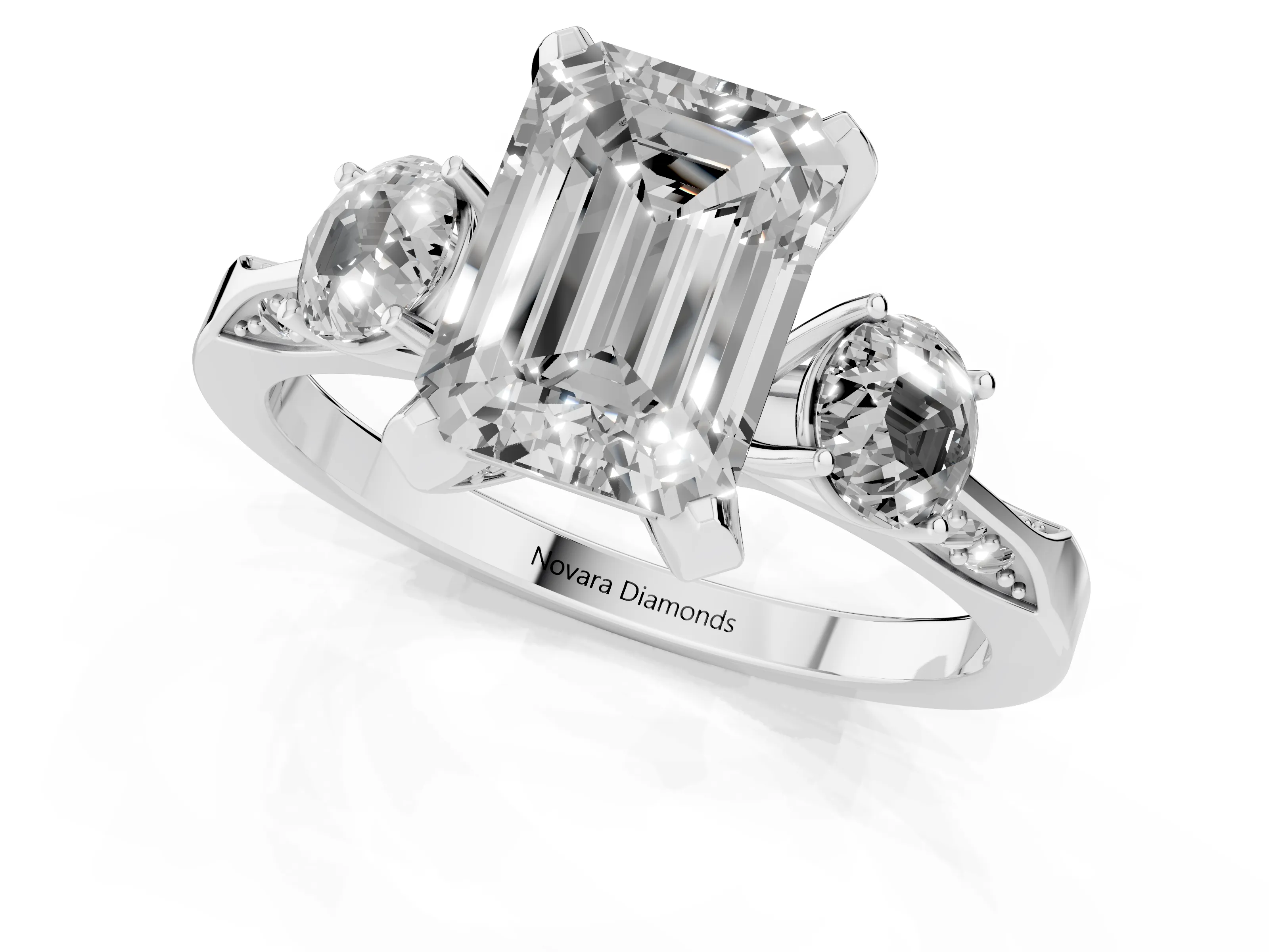 Fancy Blue Emerald Cut Diamond Three-Stone Ring Set in White gold with Pavé Band and Smaller Side Stones