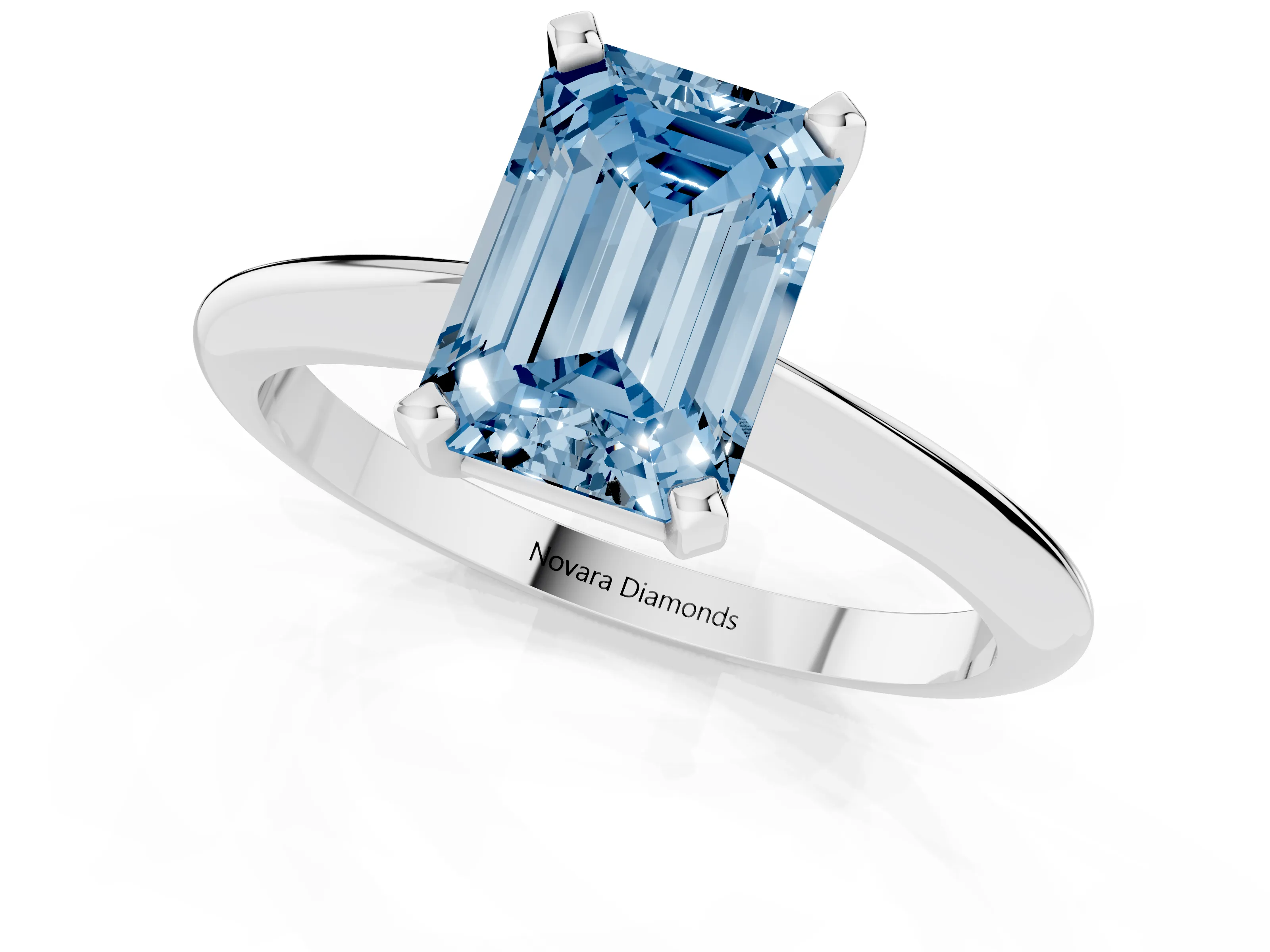 Fancy Blue Emerald Cut Diamond Solitaire Ring Set in Silver with Prong Setting on a Plain Round Band