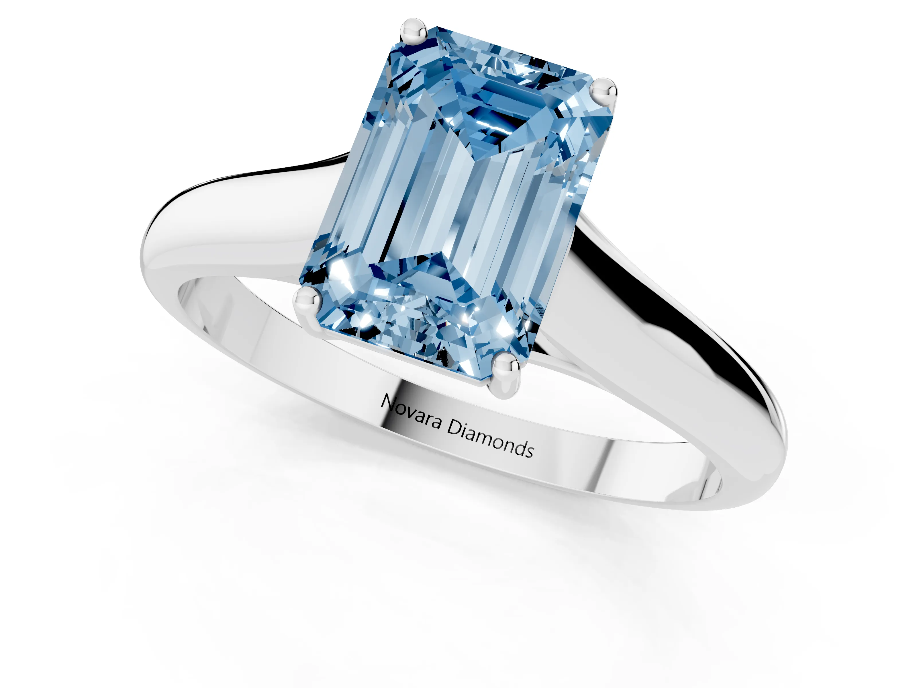 Fancy Blue Emerald Cut Diamond Solitaire Engagement Ring Set in White gold with Subtly Tapered Band and Prong Setting