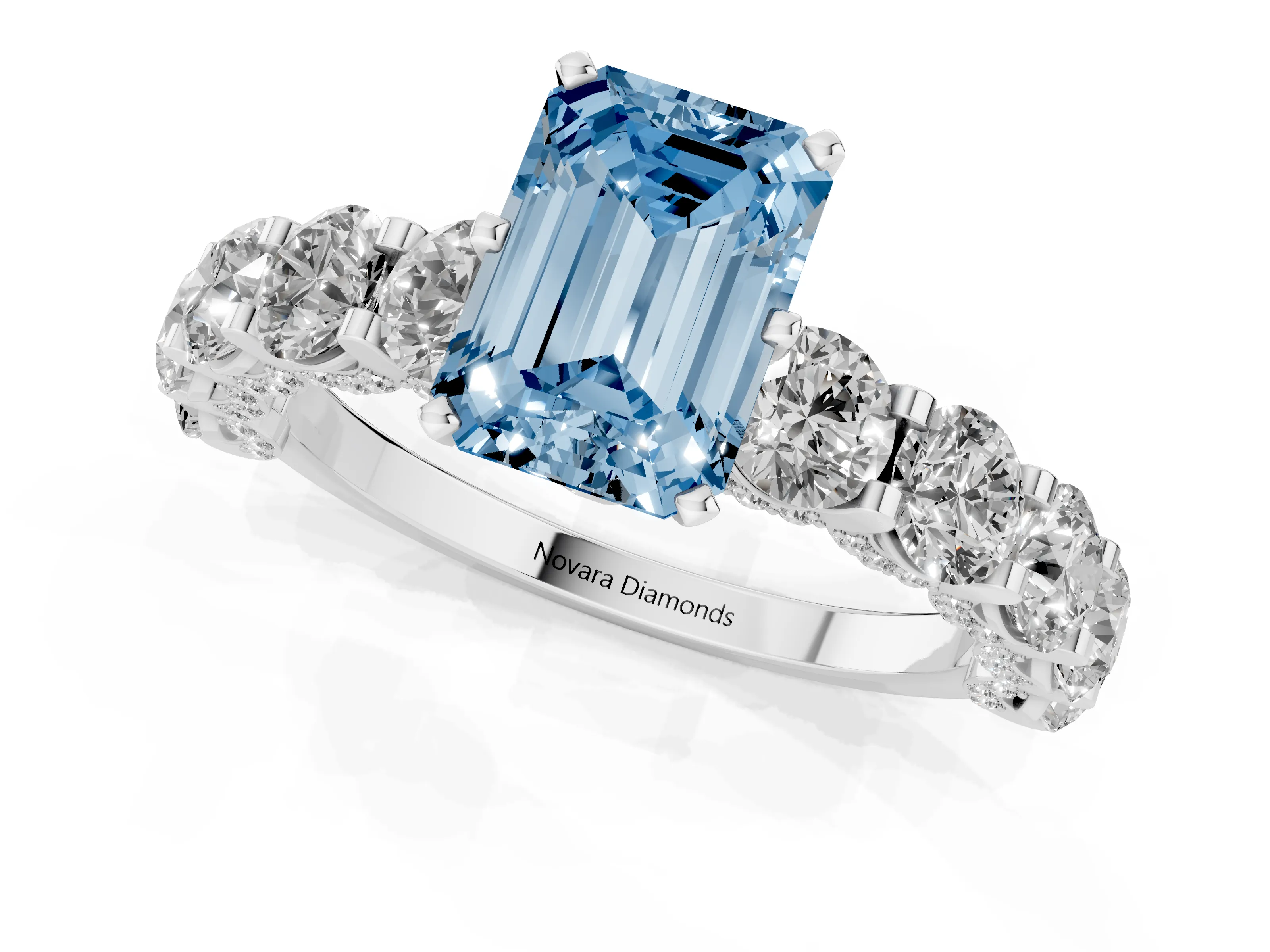 Fancy Blue Emerald Cut Diamond Side Stone Ring Set in White gold with Alternating Round and Oval Side Stones