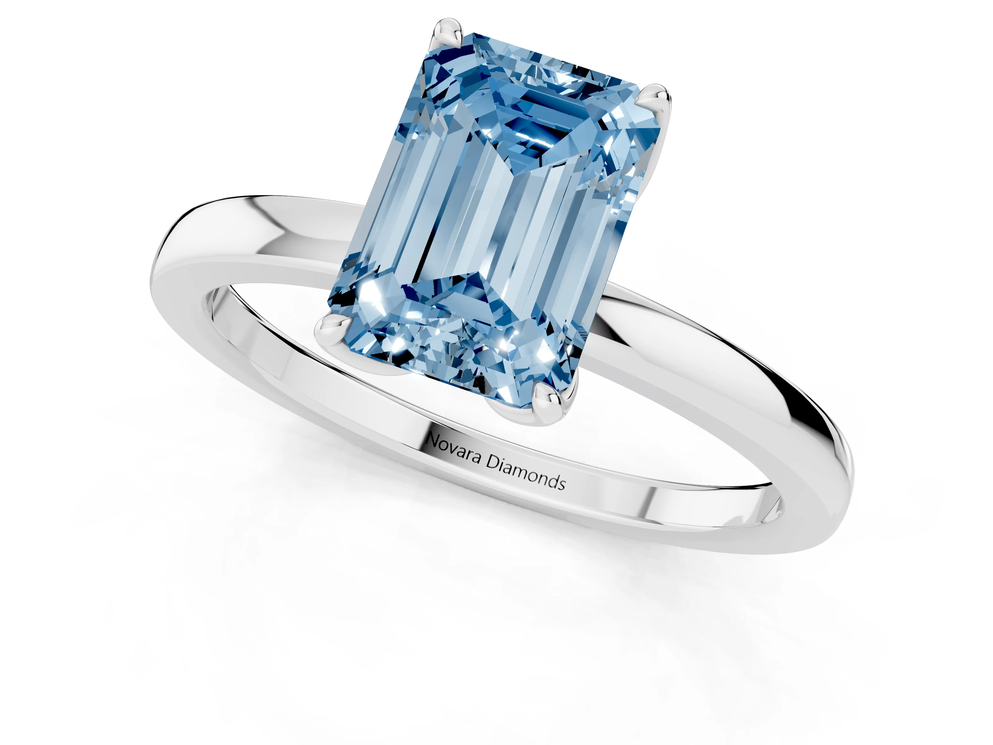 Fancy Blue Emerald Cut Diamond Solitaire Ring Set in White gold with Prong Setting and Thin Polished Band