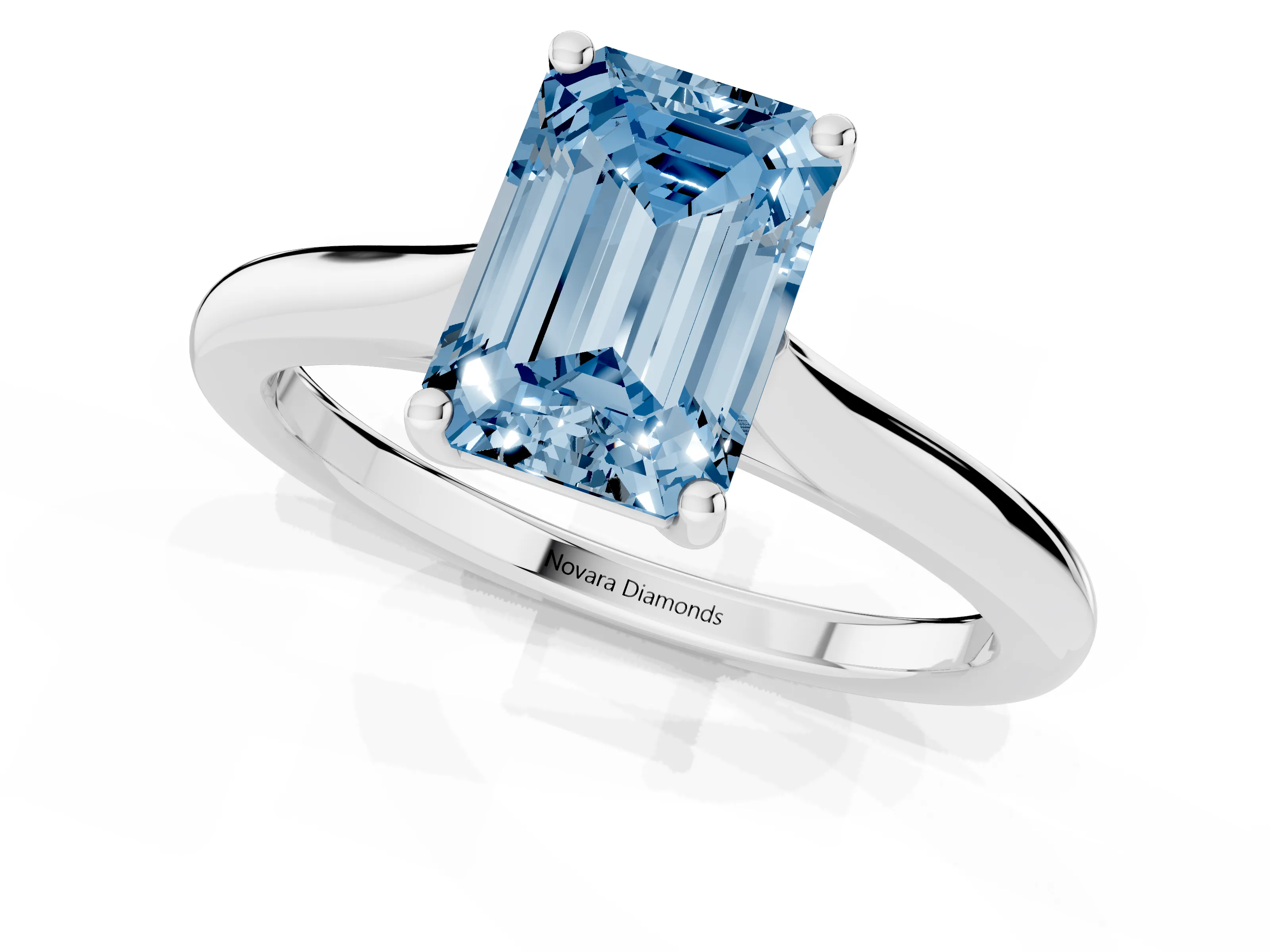 Fancy Blue Emerald Cut Diamond Solitaire Ring Set in White gold with Cathedral Band and Prong Setting