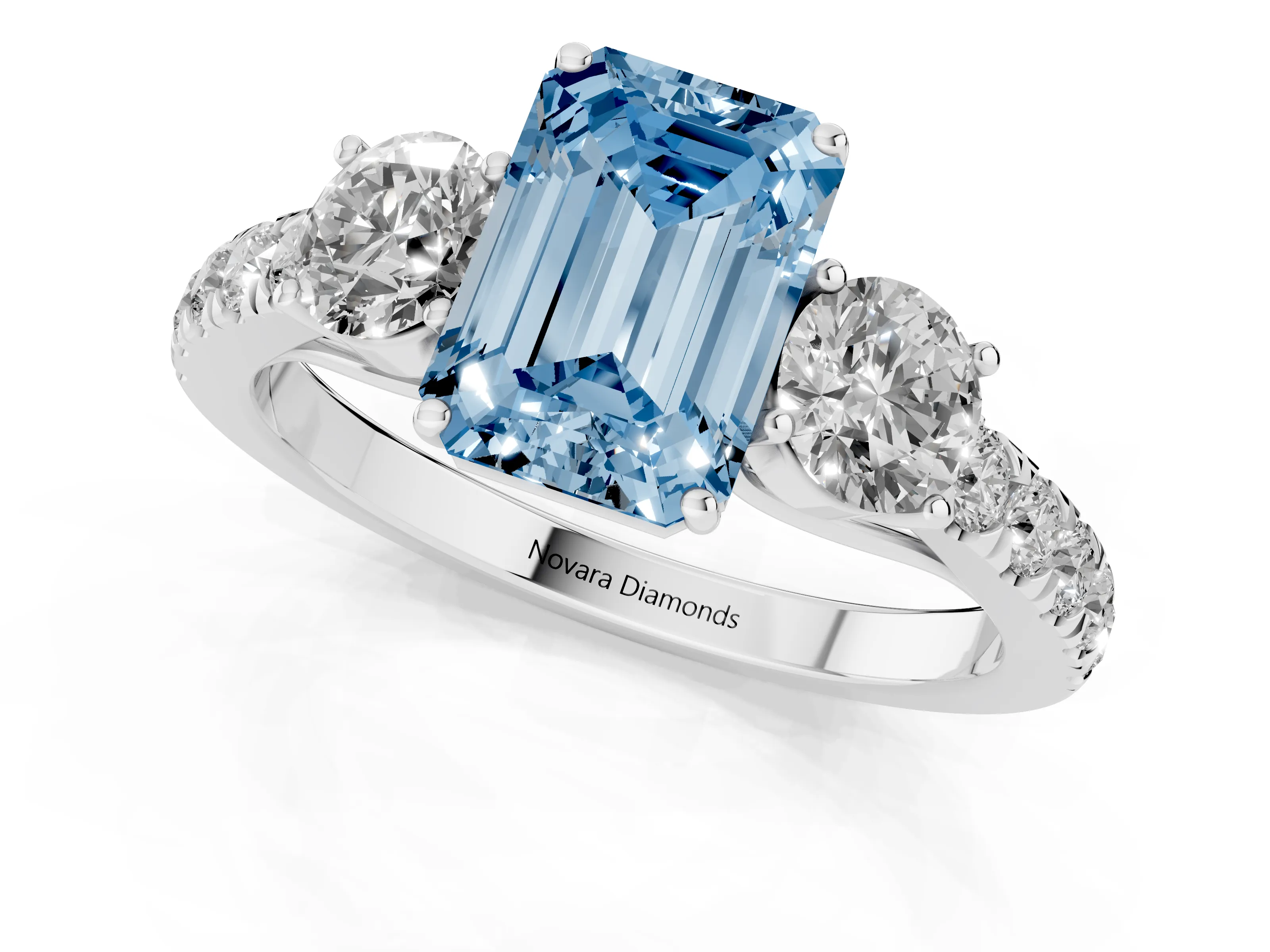 Fancy Blue Emerald Cut Diamond Three-Stone Ring Set in White gold with Round Side Stones and Delicate Pavé Band