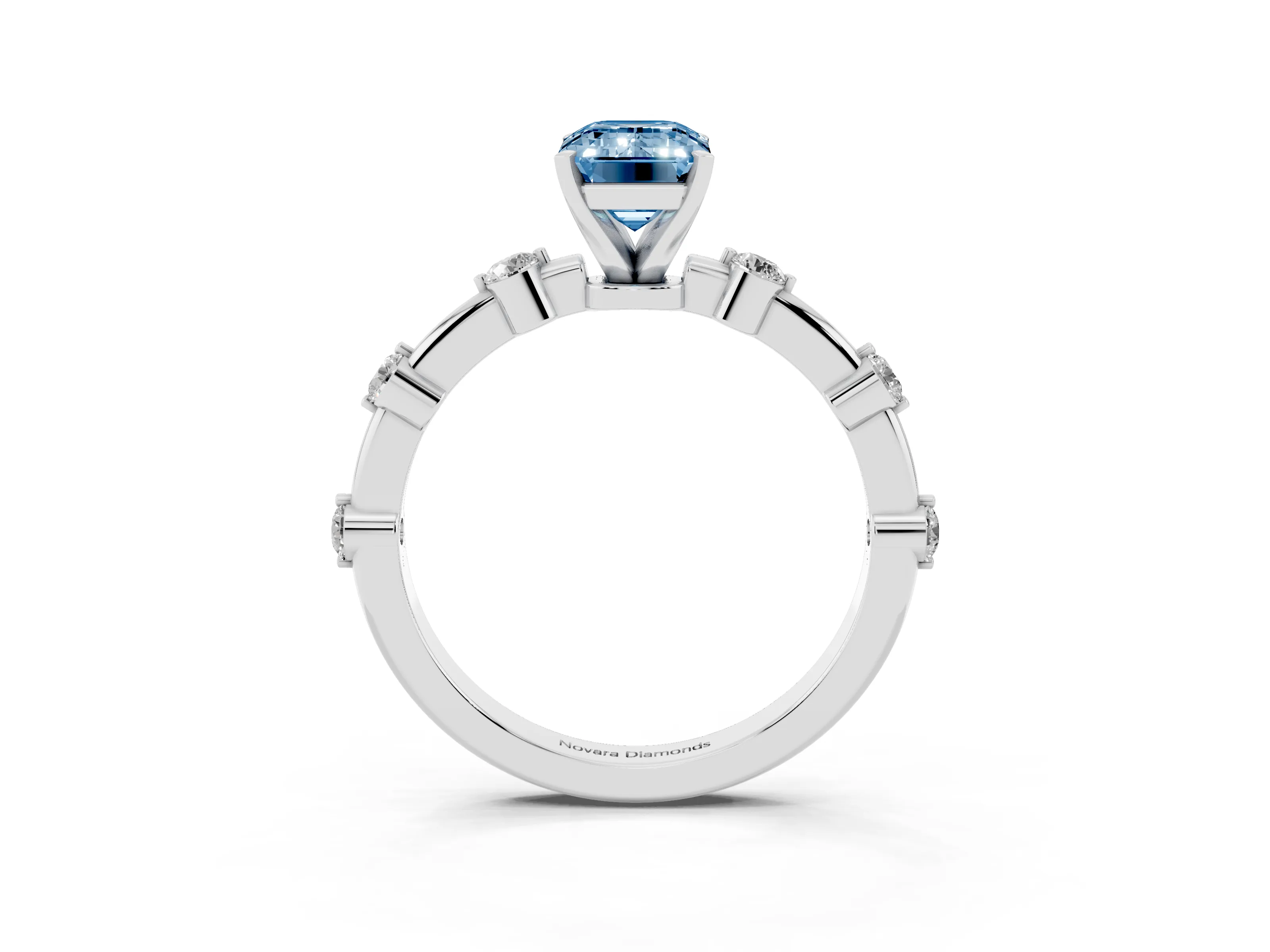 Fancy Blue Emerald Cut Diamond Solitaire Ring Set in White gold with Bezel Set Side Stones and Prong Setting