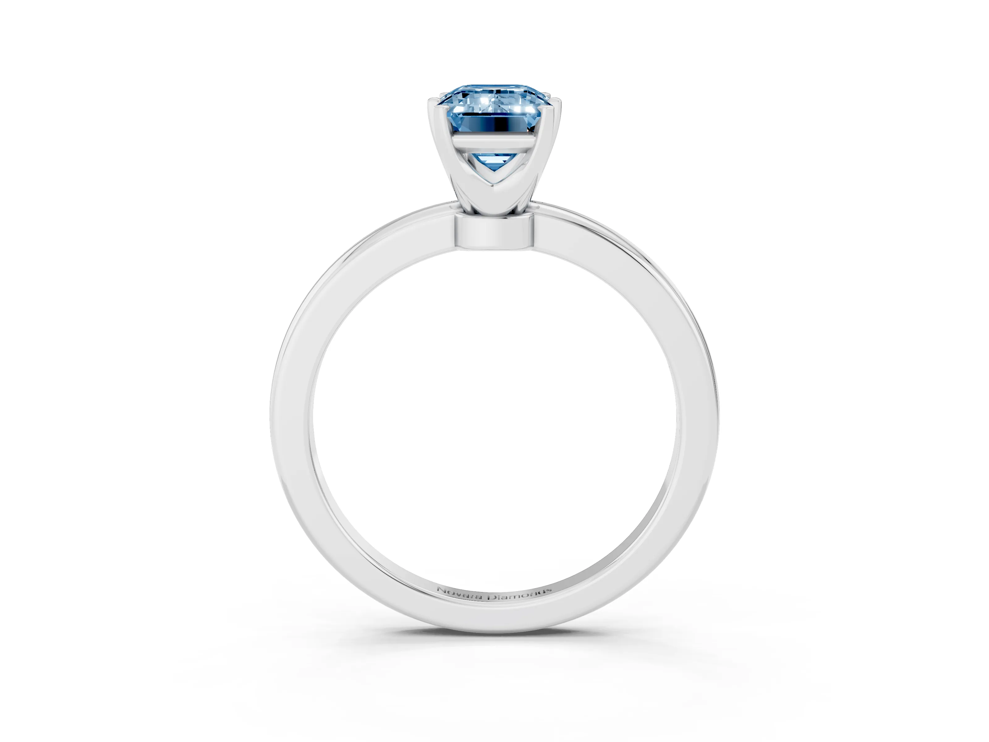 Fancy Blue Emerald Cut Diamond Solitaire Ring Set in Silver with Raised Prong Setting on a Classic Band