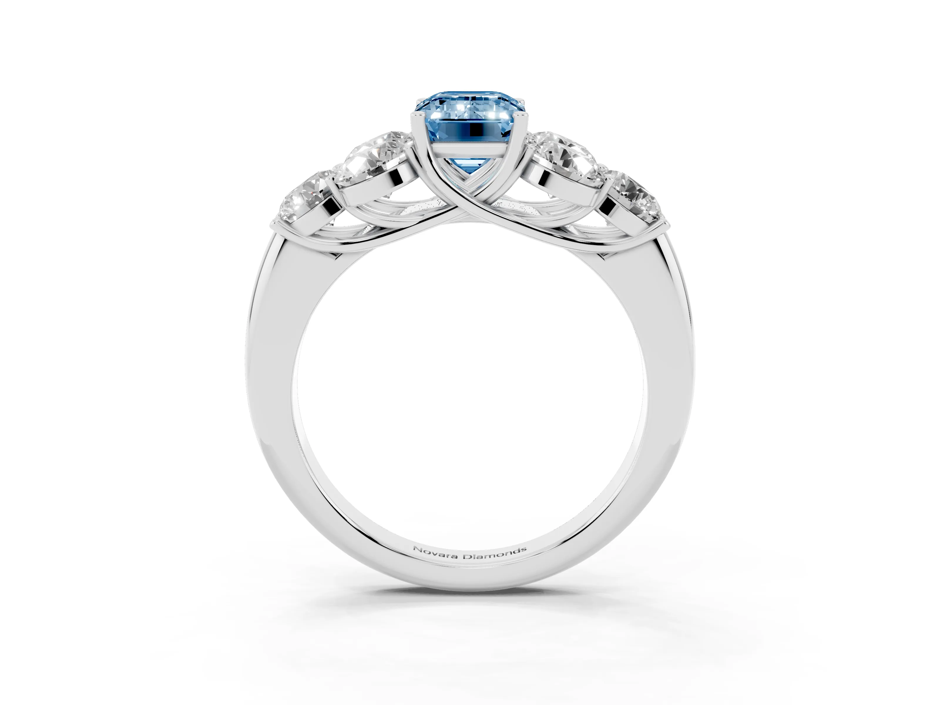 Fancy Blue Emerald Cut Diamond Cluster Ring Set in Silver with Round Accent Stones and Prong Setting on a Plain Band