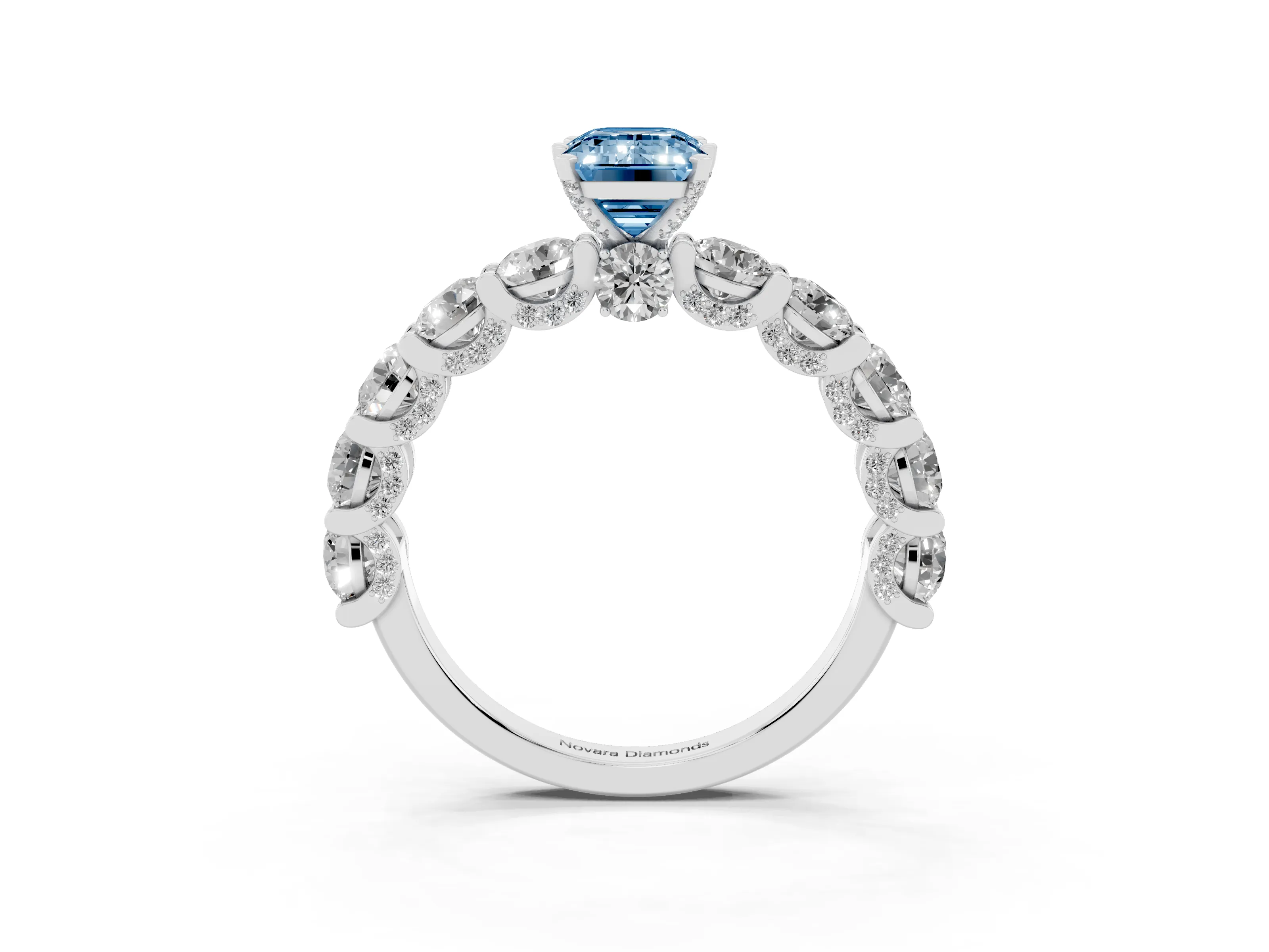 Fancy Blue Emerald Cut Diamond Side Stone Ring Set in White gold with Alternating Round and Oval Side Stones