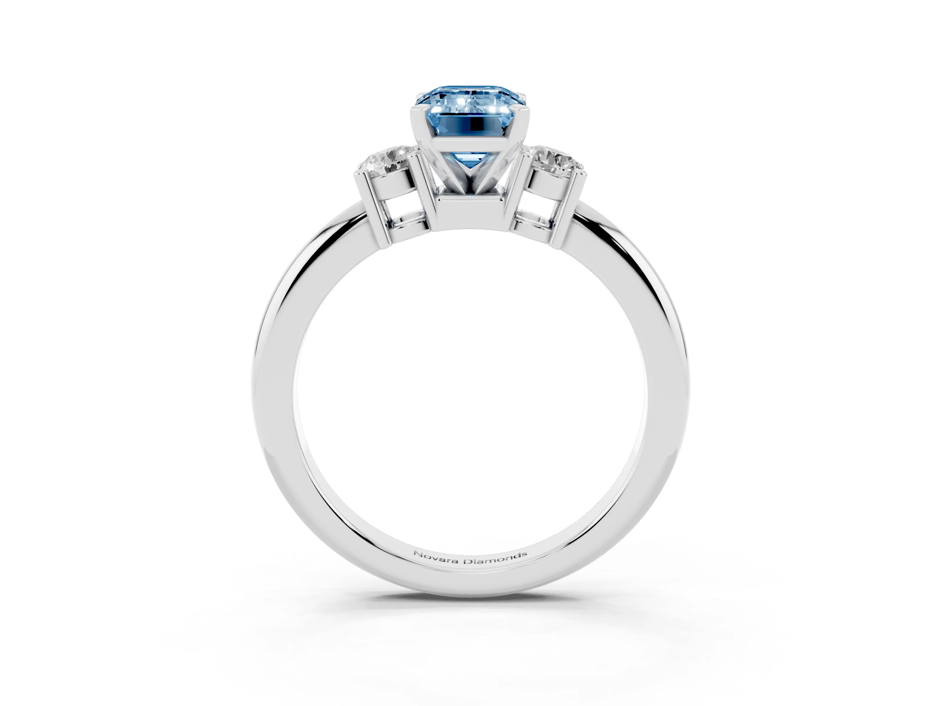 Fancy Blue Three-Stone Emerald Cut Diamond Ring Set in Platinum with Prong Setting and Plain Band