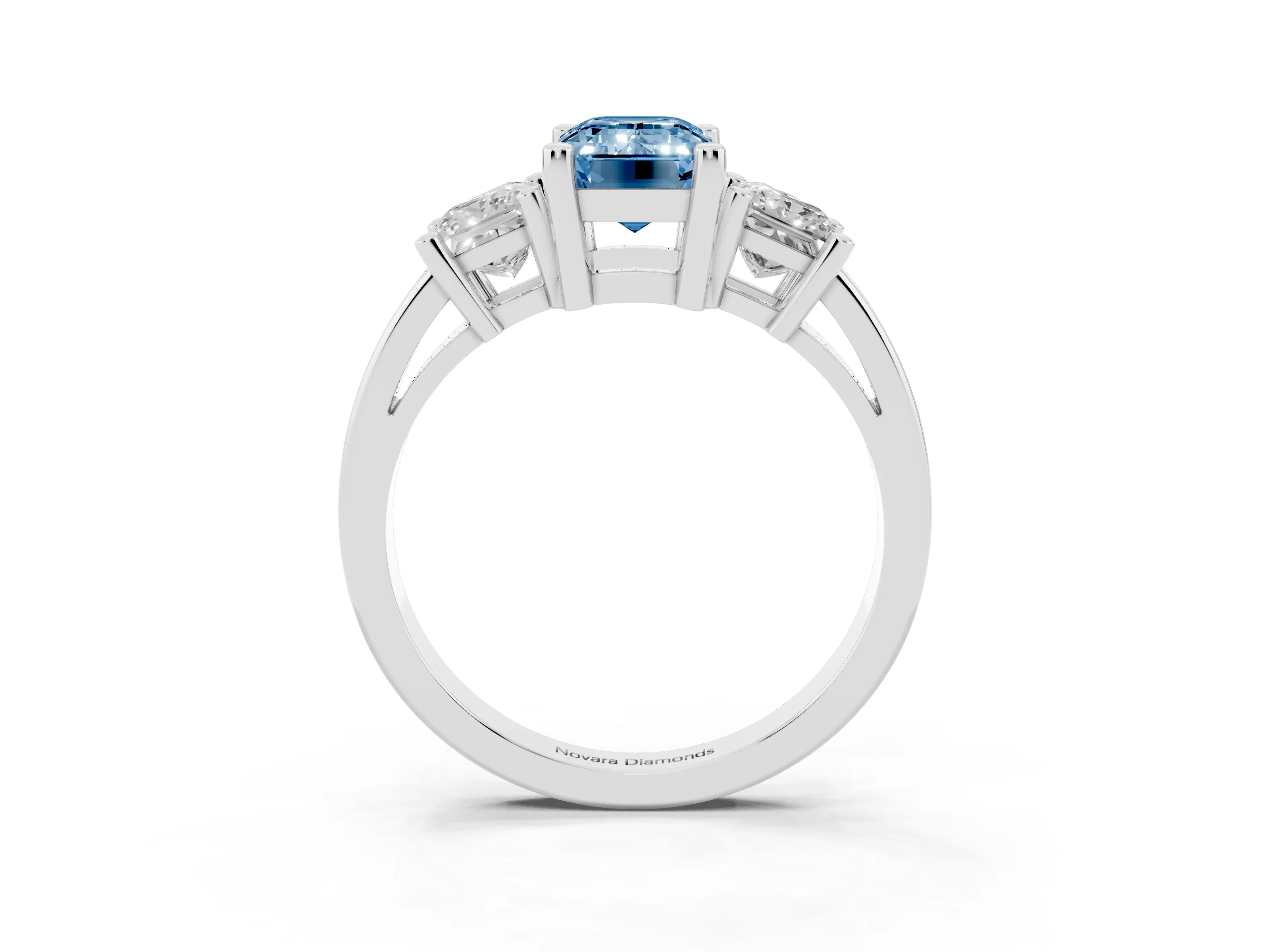 Fancy Blue Three-Stone Emerald Cut Diamond Solitaire Ring Set in Platinum with Prong Setting