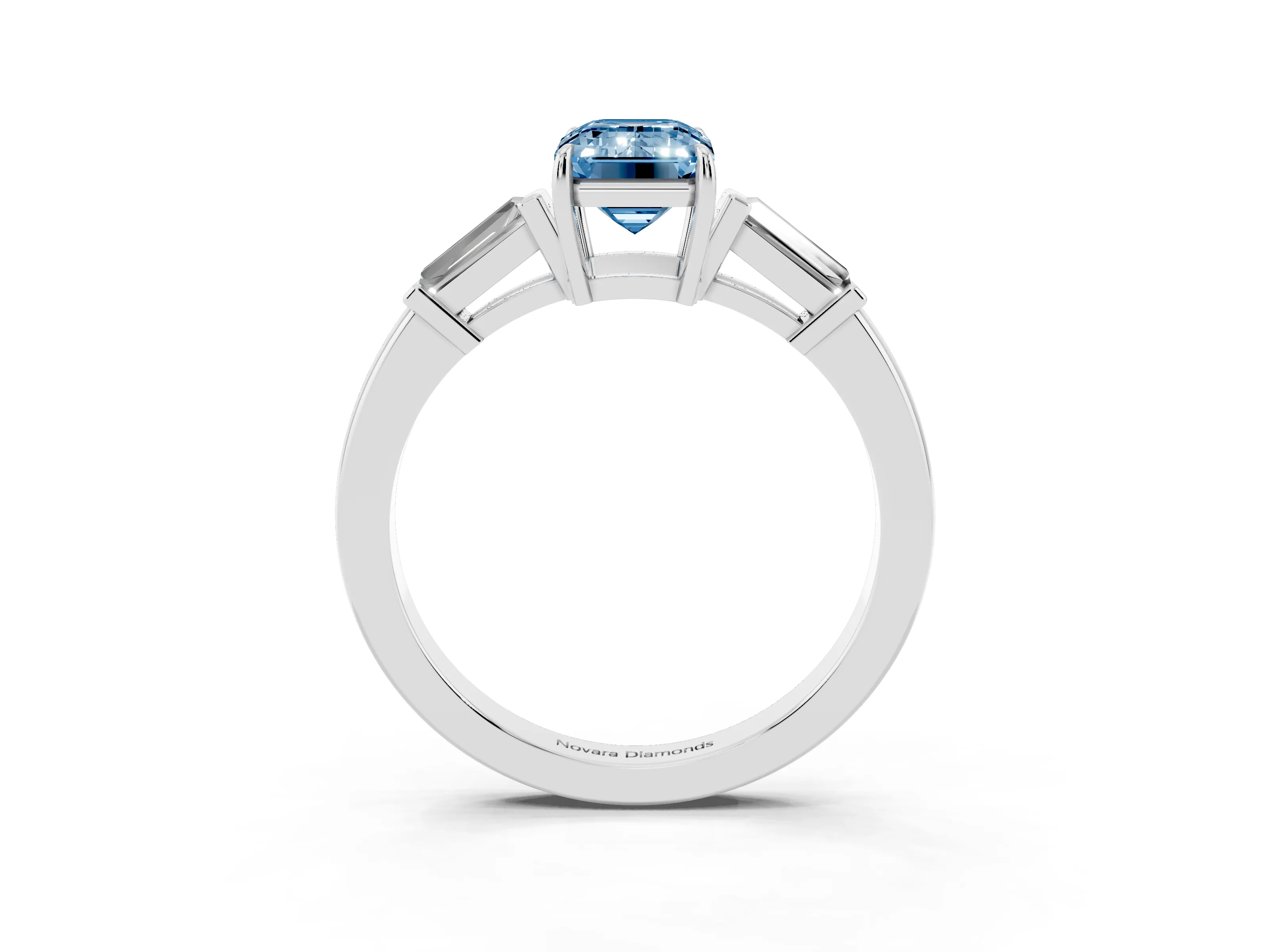 Fancy Blue Emerald Cut Diamond Three-Stone Ring Set in Platinum with Tapered Baguette Side Stones and Prong Setting