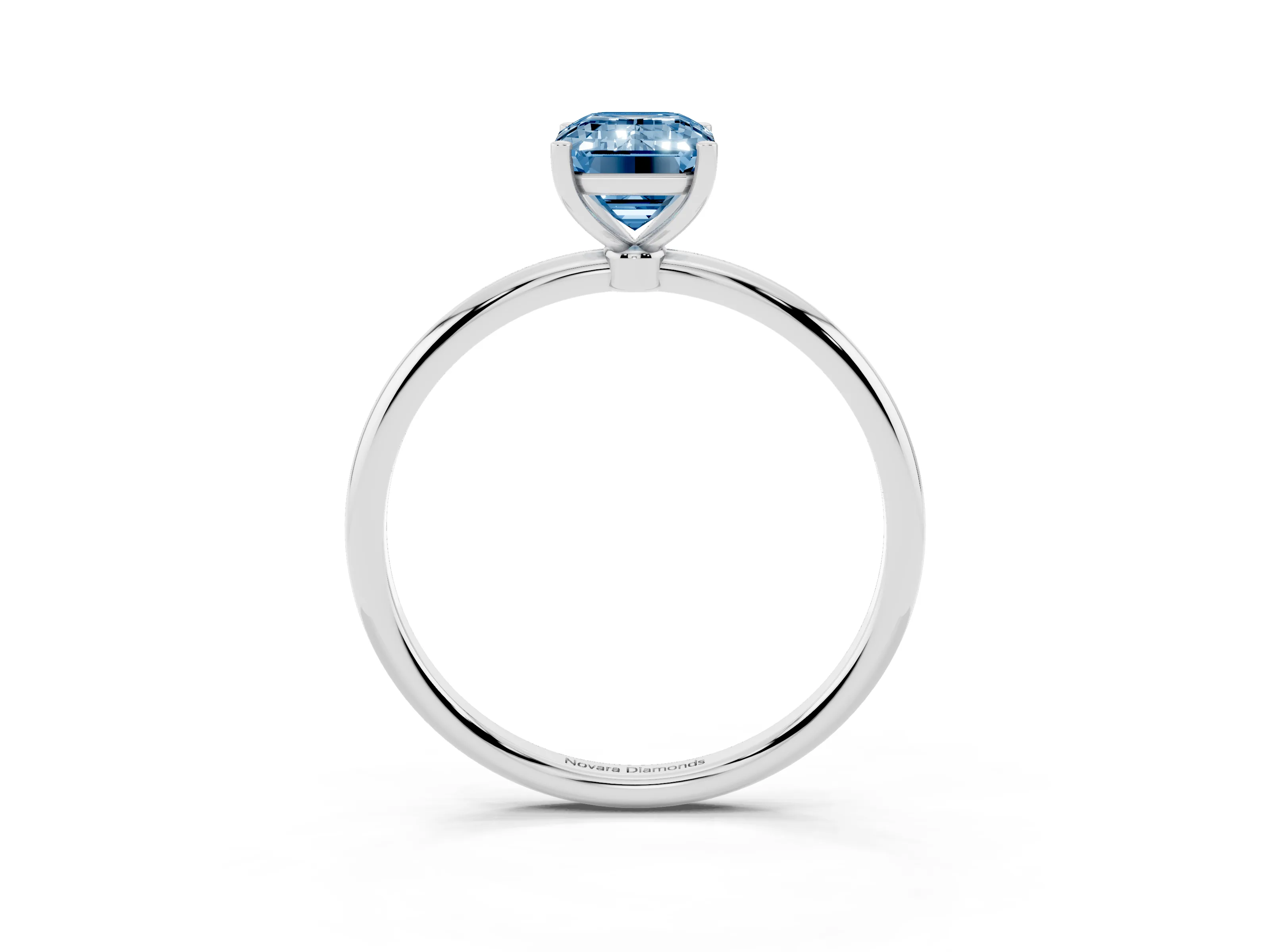 Fancy Blue Emerald Cut Diamond Solitaire Engagement Ring Set in Platinum with Thin Band and Prong Setting
