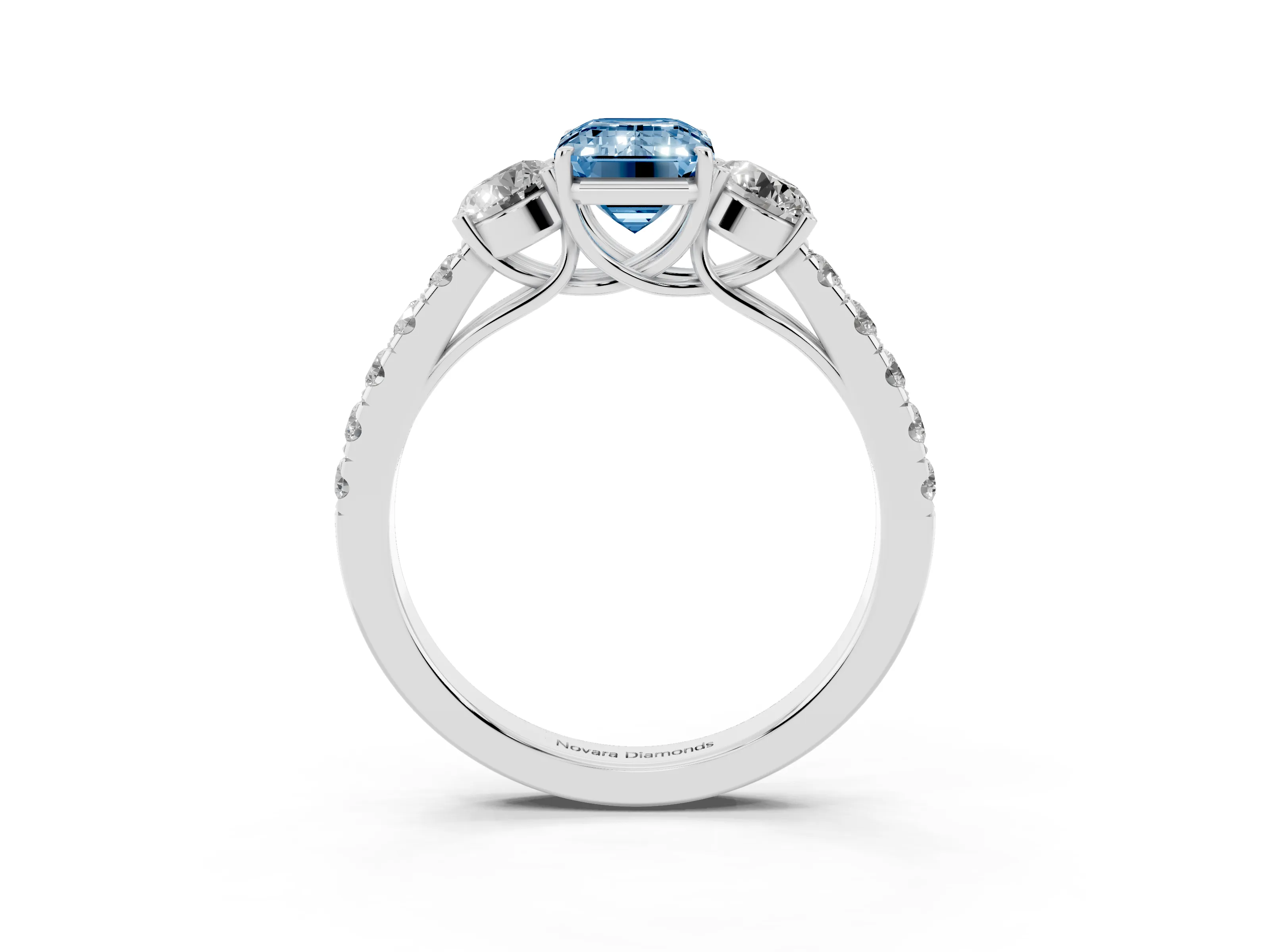Fancy Blue Emerald Cut Diamond Three-Stone Ring Set in White gold with Round Side Stones and Delicate Pavé Band