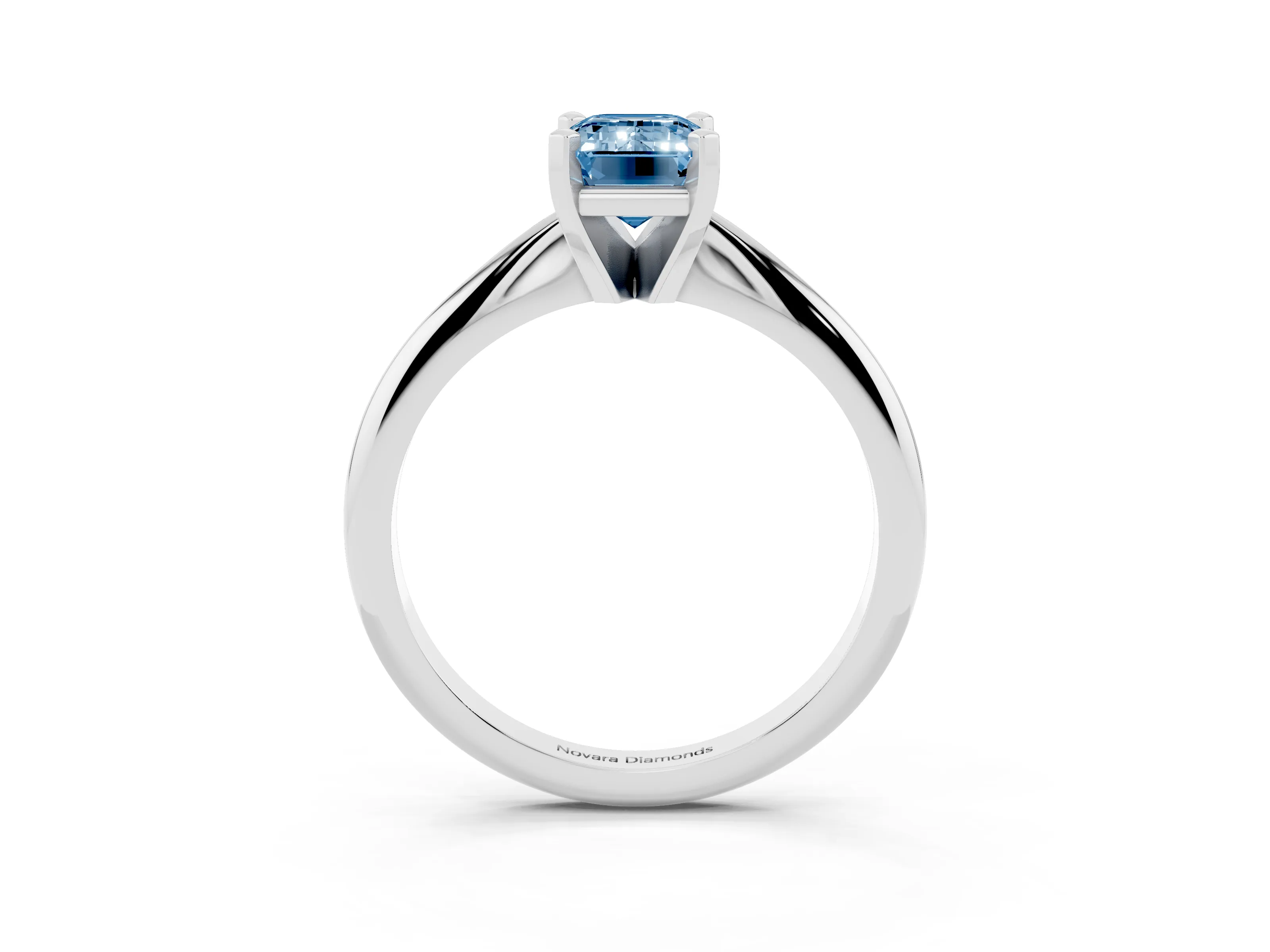 Fancy Blue Emerald Cut Diamond Solitaire Ring Set in Silver with Prong Setting on a Plain Round Band