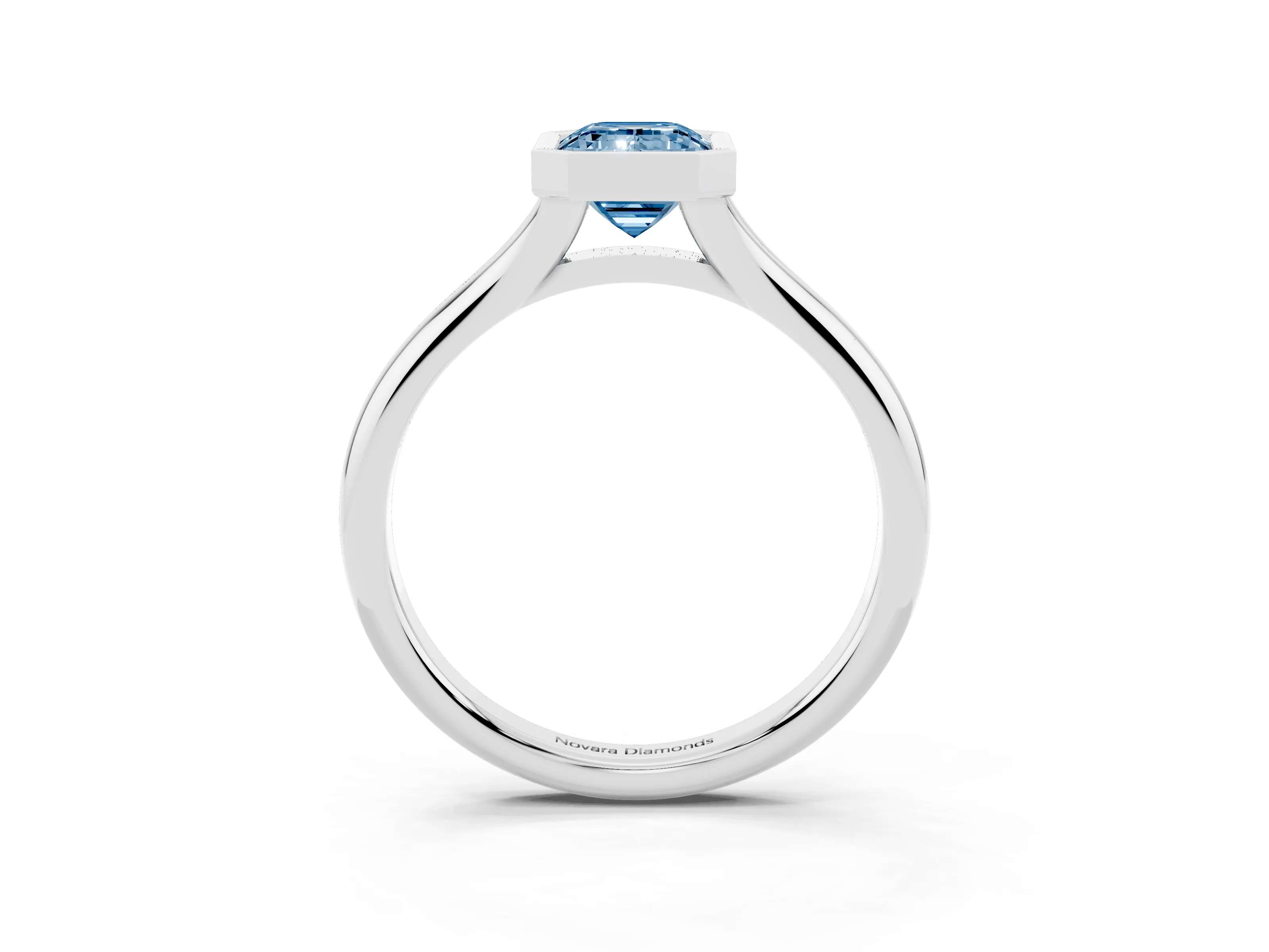 Fancy Blue Bezel Set Emerald Cut Diamond Solitaire Ring Set in White gold with Smooth Band