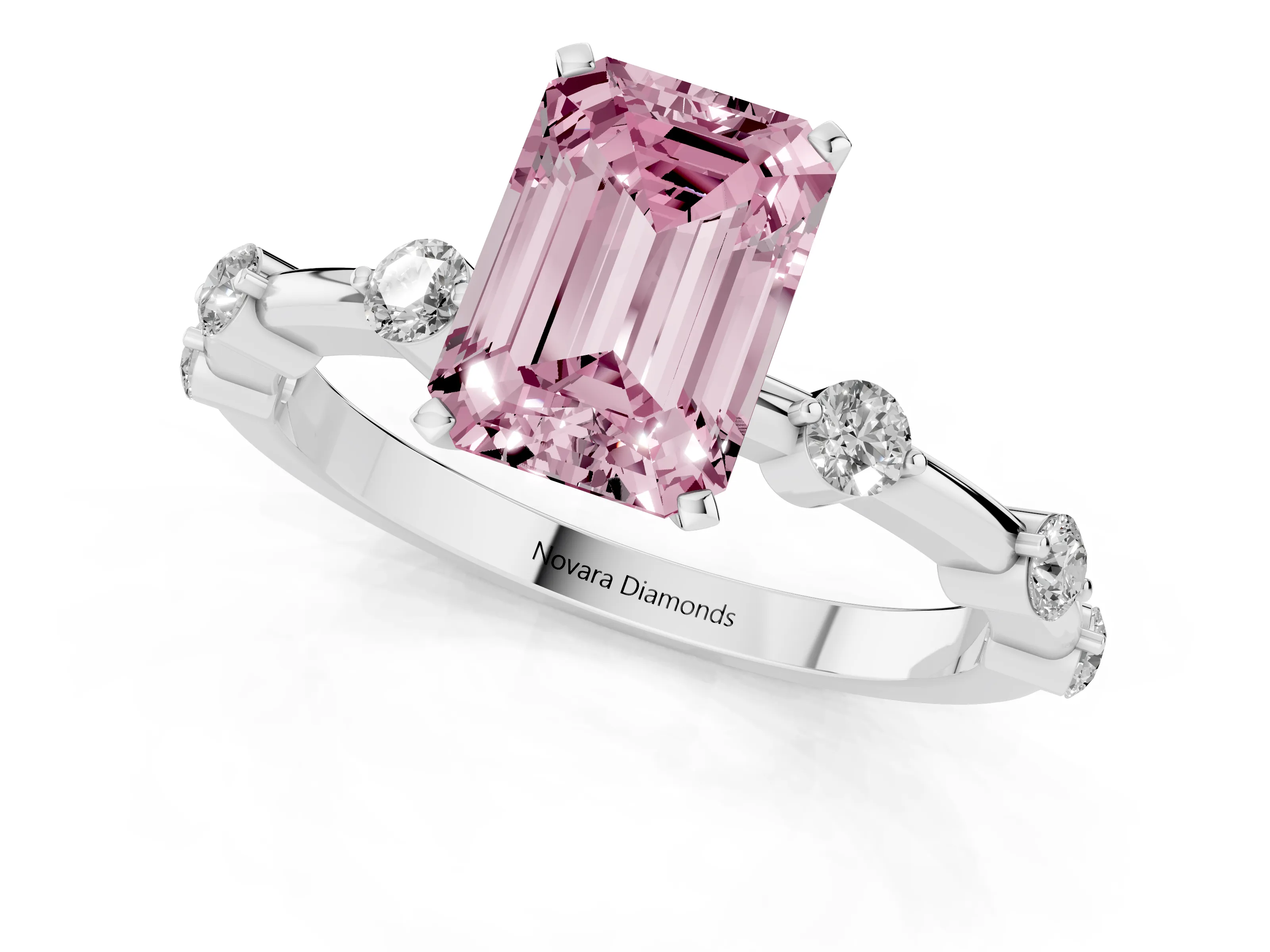 Fancy Pink Emerald Cut Diamond Solitaire Ring Set in White gold with Bezel Set Side Stones and Prong Setting