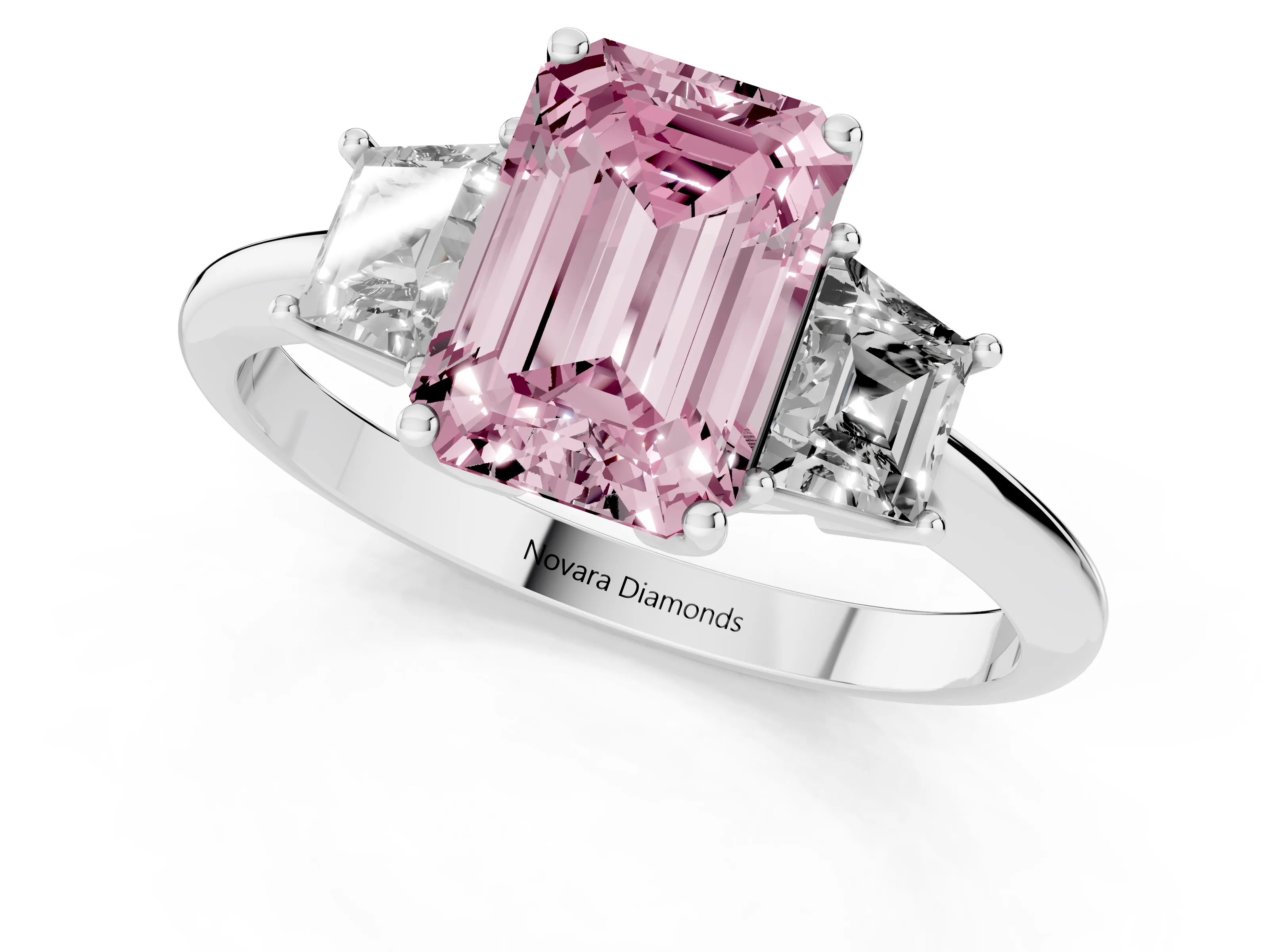 Fancy Pink Emerald Cut Diamond Three-Stone Ring Set in Platinum with Trapezoid Side Stones and Prong Setting