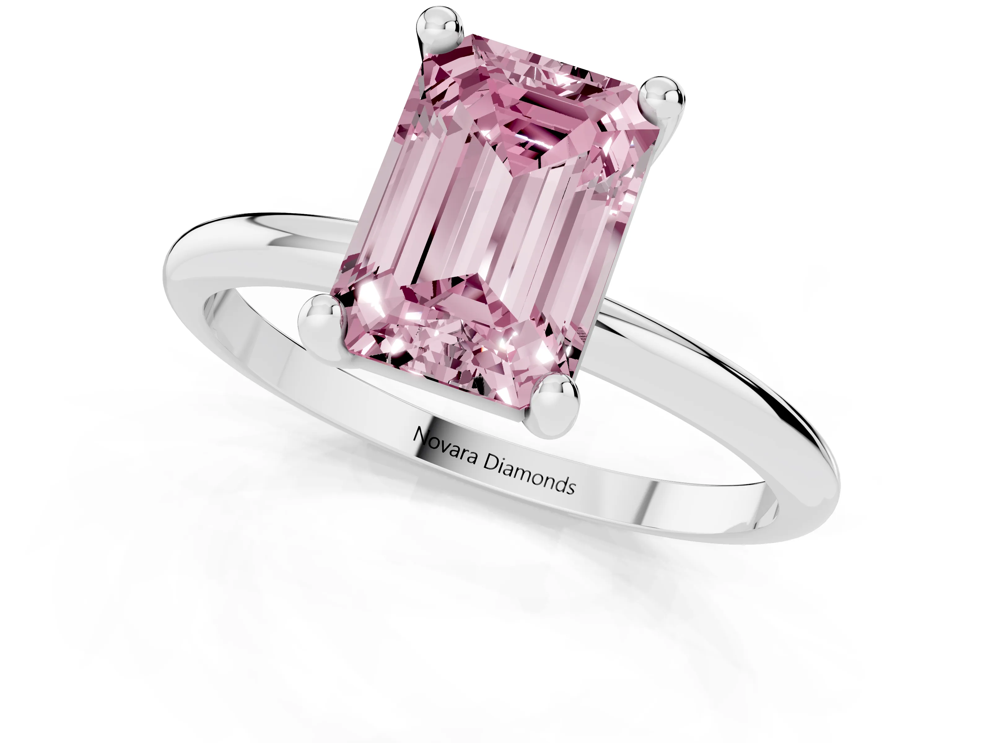 Fancy Pink Emerald Cut Diamond Solitaire Ring Set in White gold with Secure Prong Setting on a Classic Band