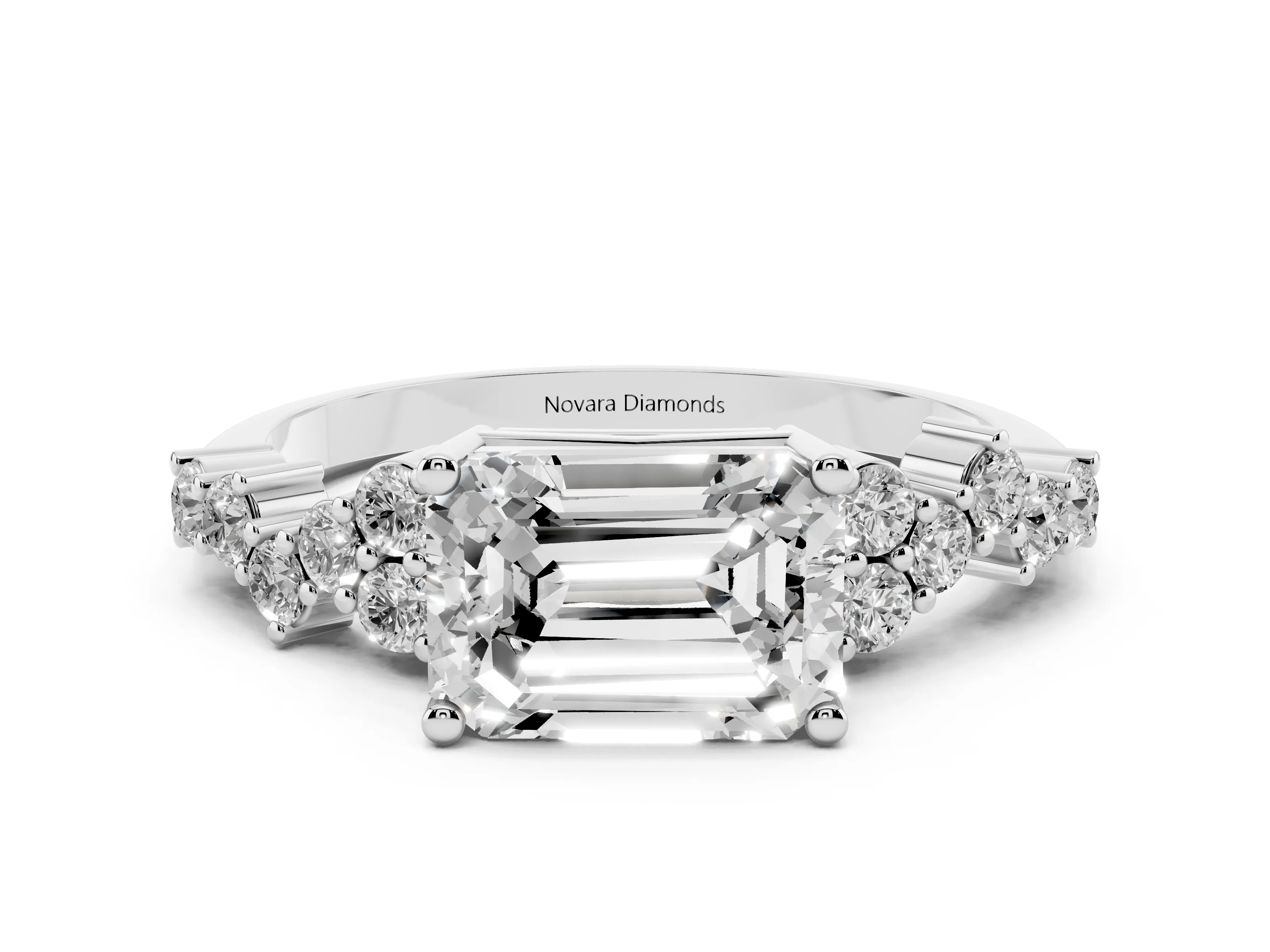 Emerald Cut Diamond Ring Set in Platinum with Scattered Round Accents
