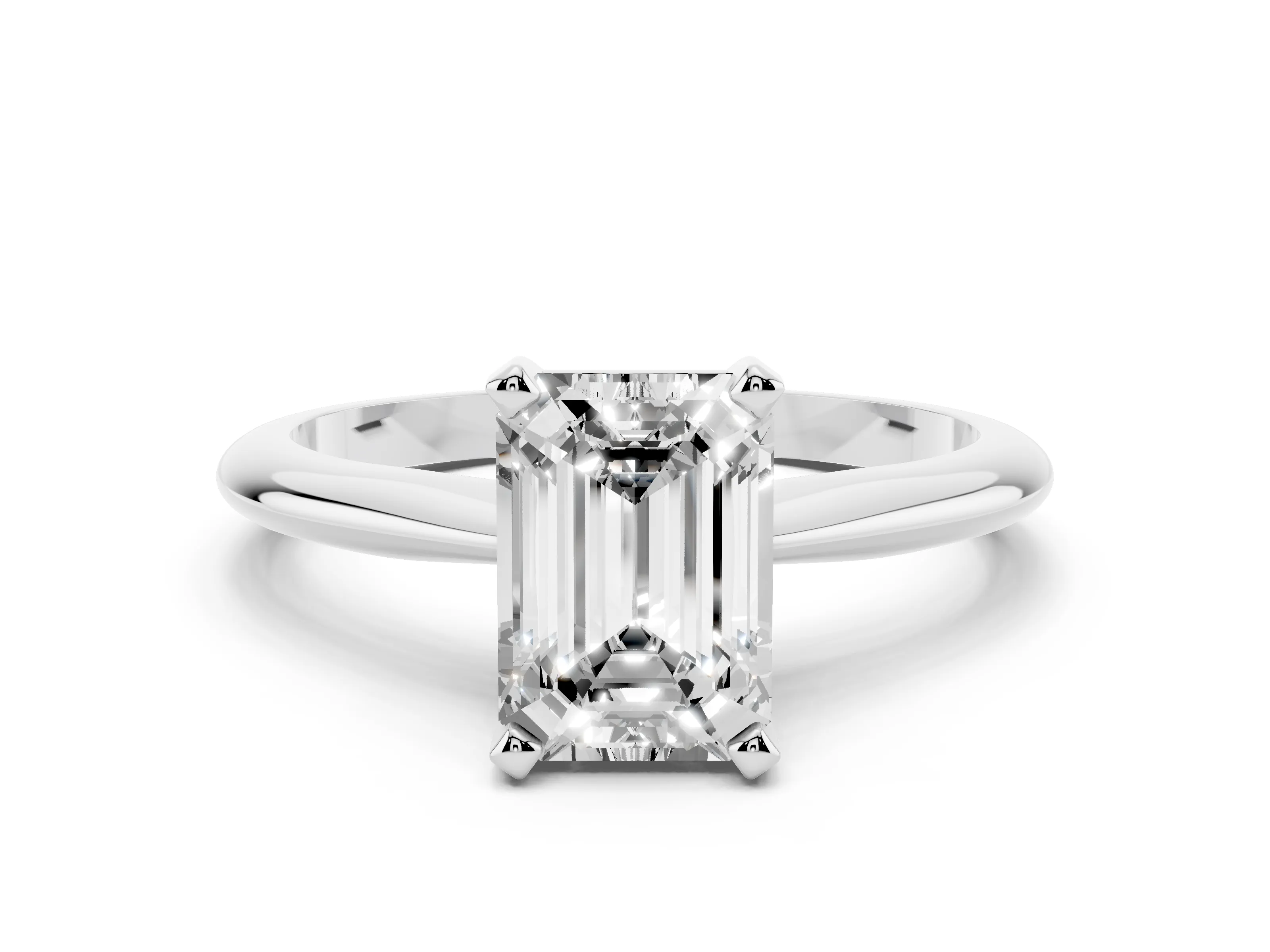 Emerald Cut Diamond Solitaire Ring Set in White gold with Prong Setting on a Plain Round Band