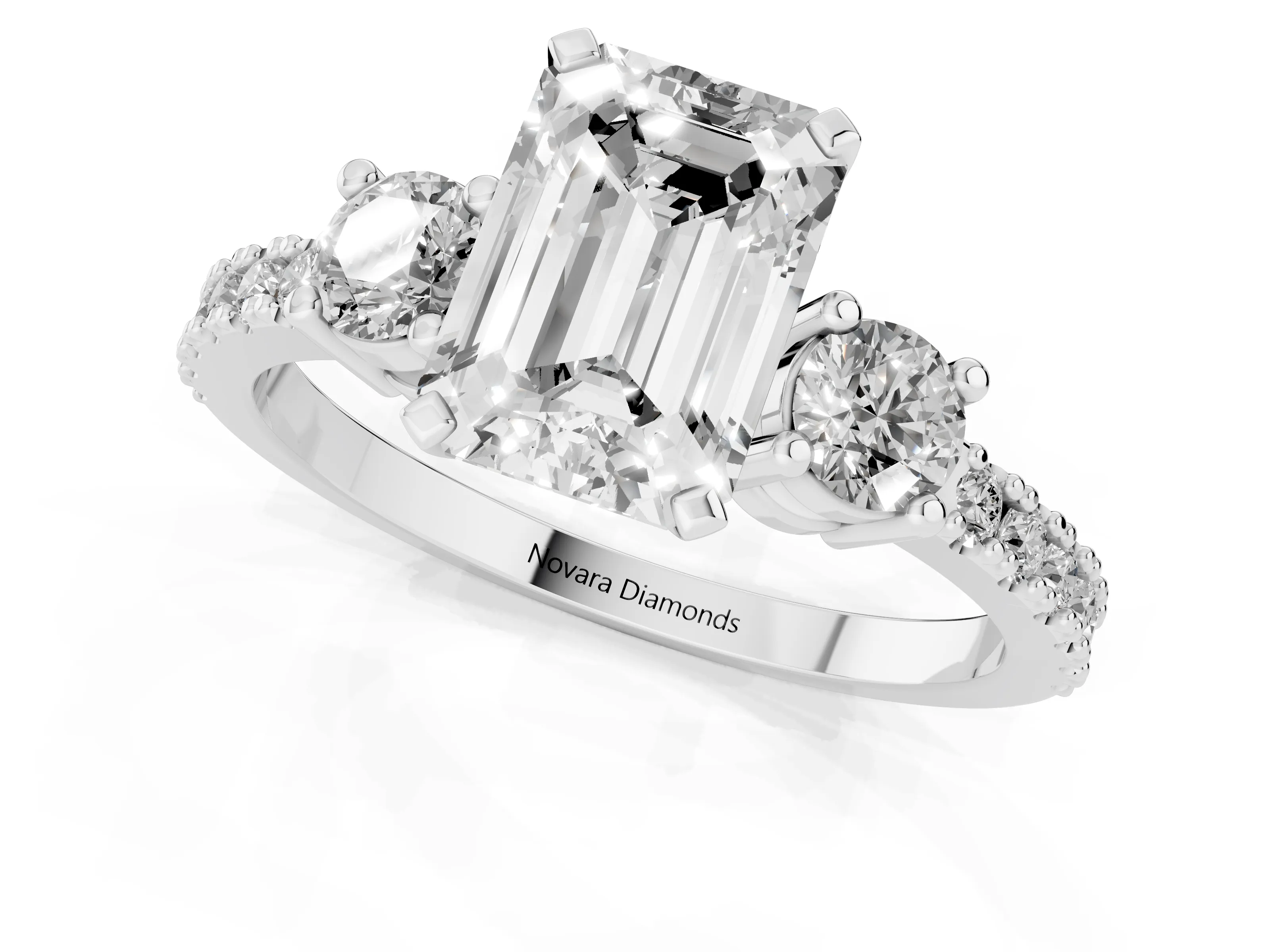 Three-Stone Emerald Cut Diamond Pavé Band Ring Set in Platinum with Prong Setting