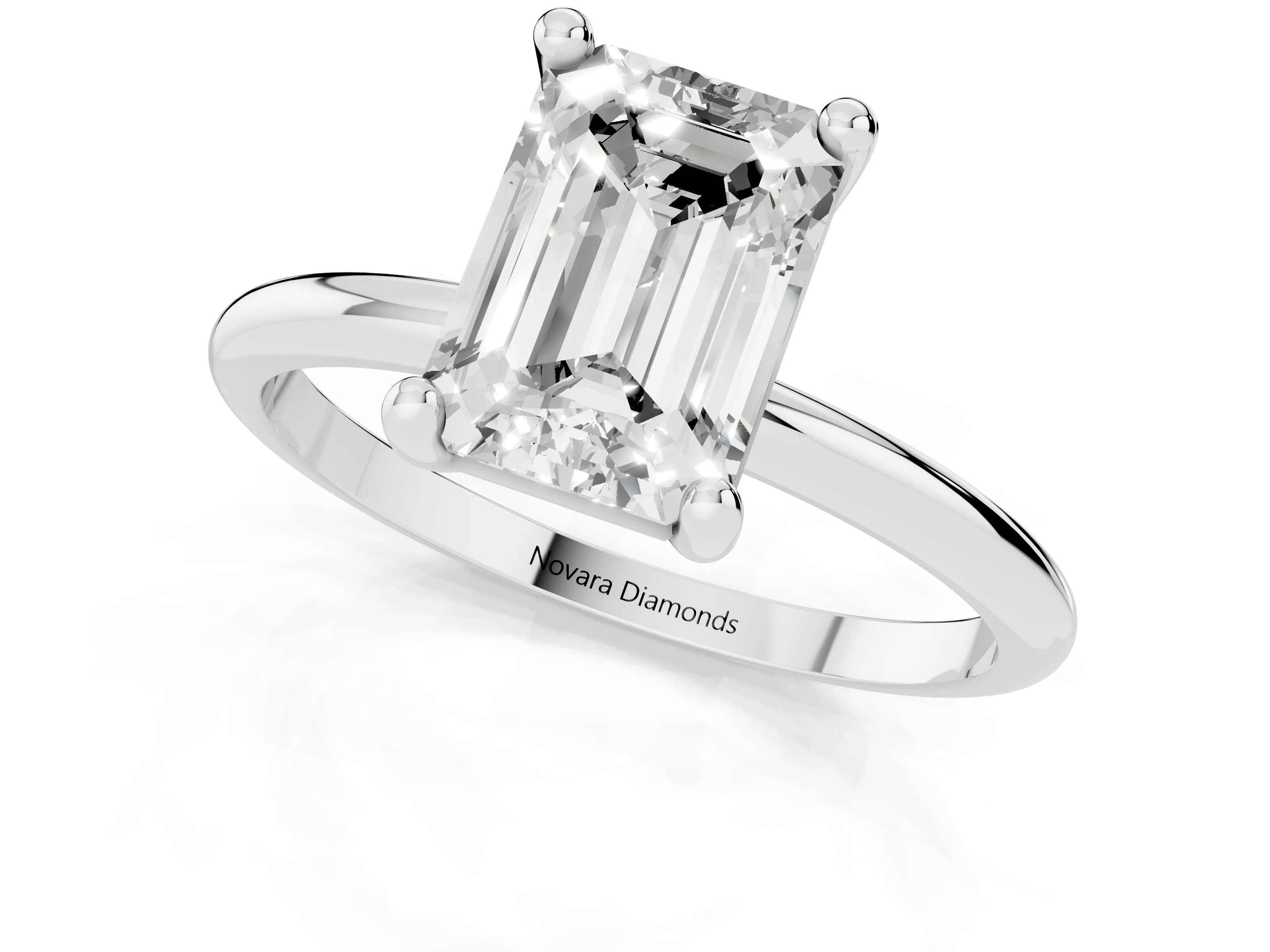 Emerald Cut Diamond Solitaire Ring Set in Silver with Secure Prong Setting on a Classic Band