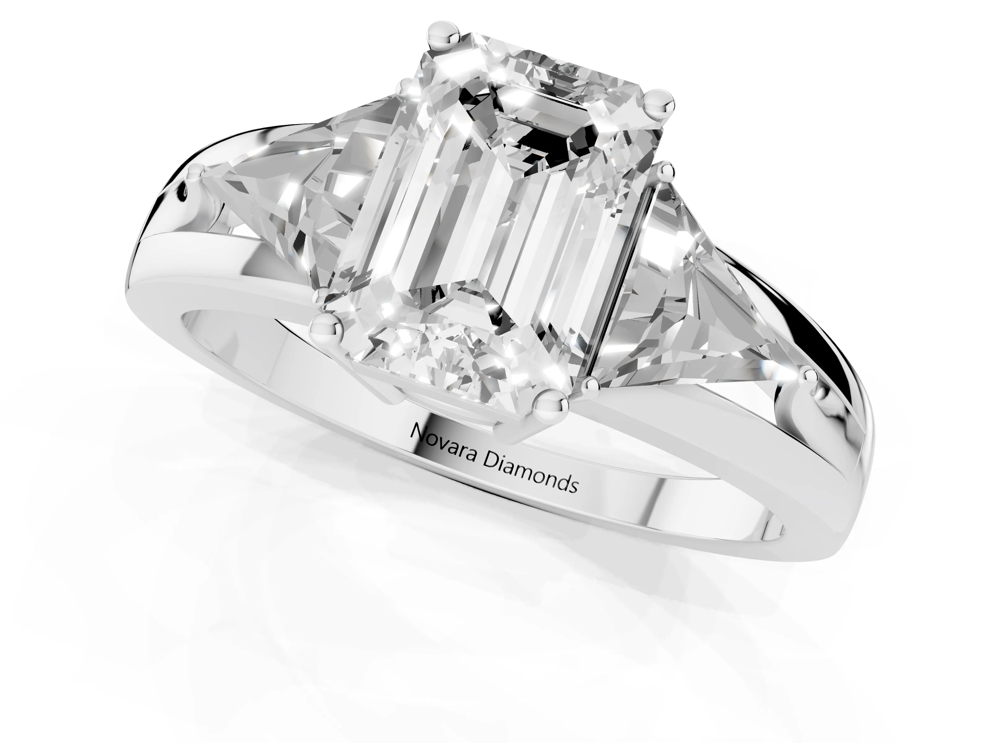 Emerald Cut Diamond Three-Stone Ring Set in Platinum with Trillion Side Stones and Split Shank