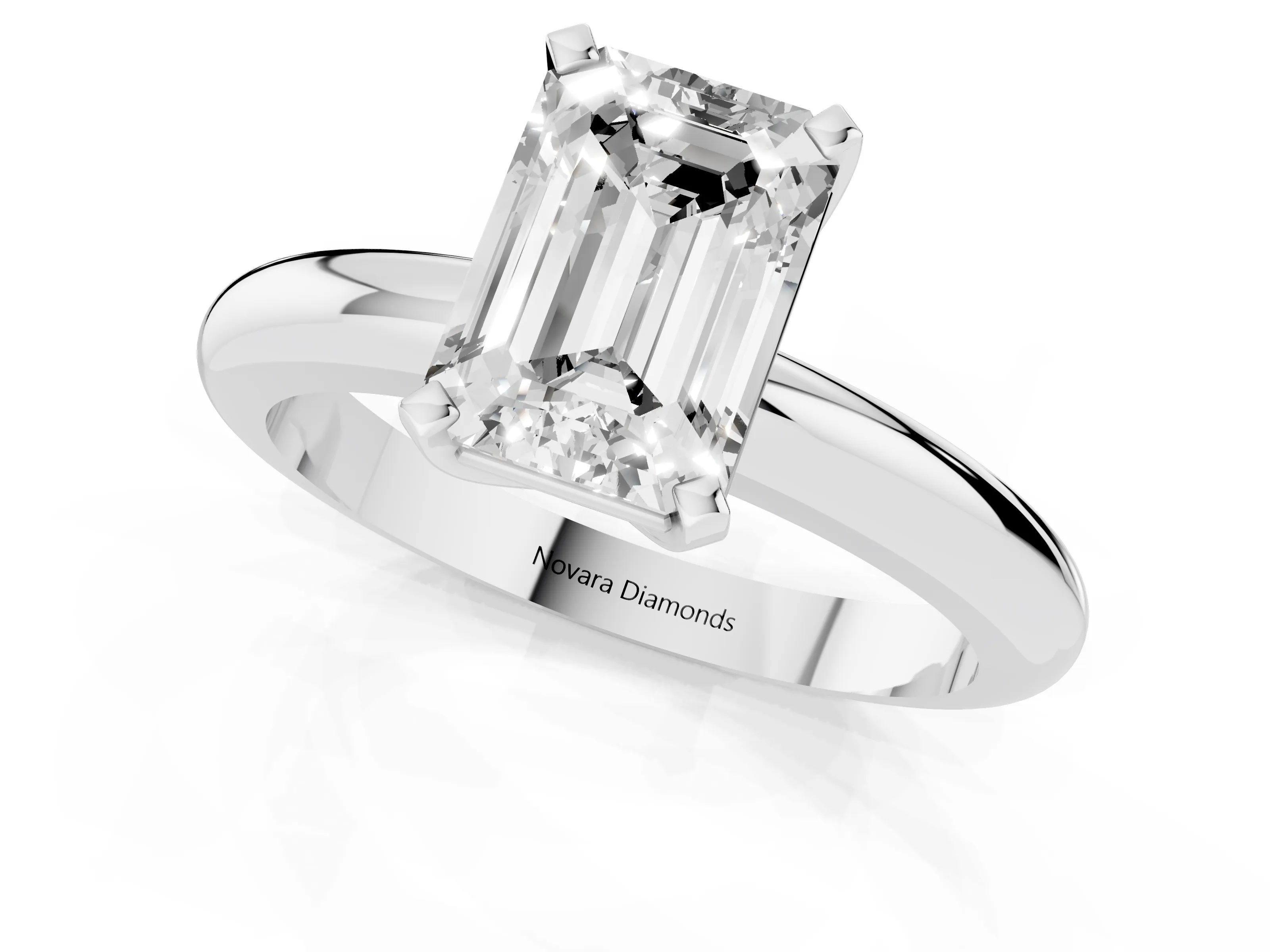 Emerald Cut Diamond Solitaire Engagement Ring Set in Platinum with Round Band and Prong Setting