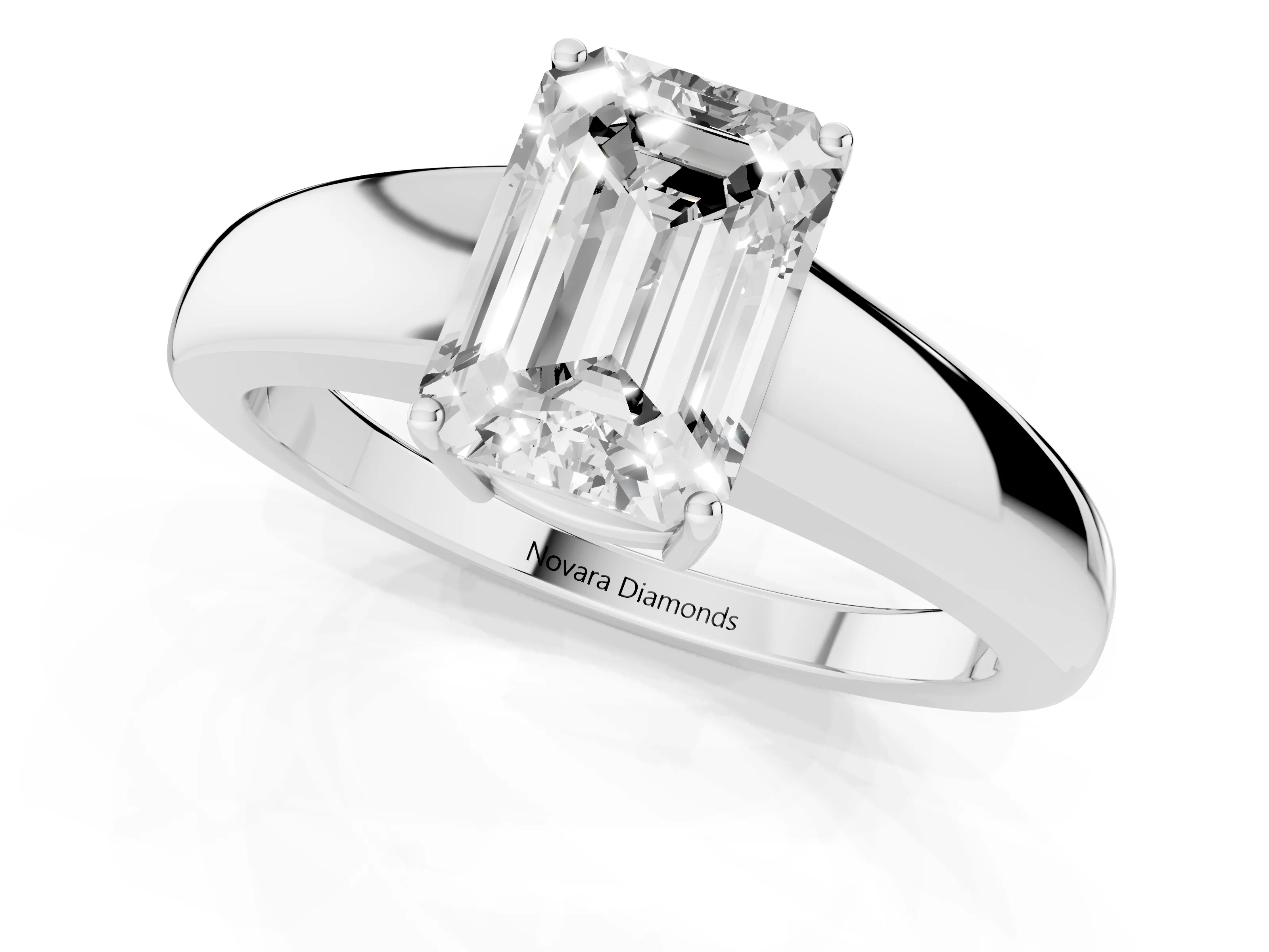 Emerald Cut Diamond Solitaire Ring Set in White gold with Tapered Band and Prong Setting