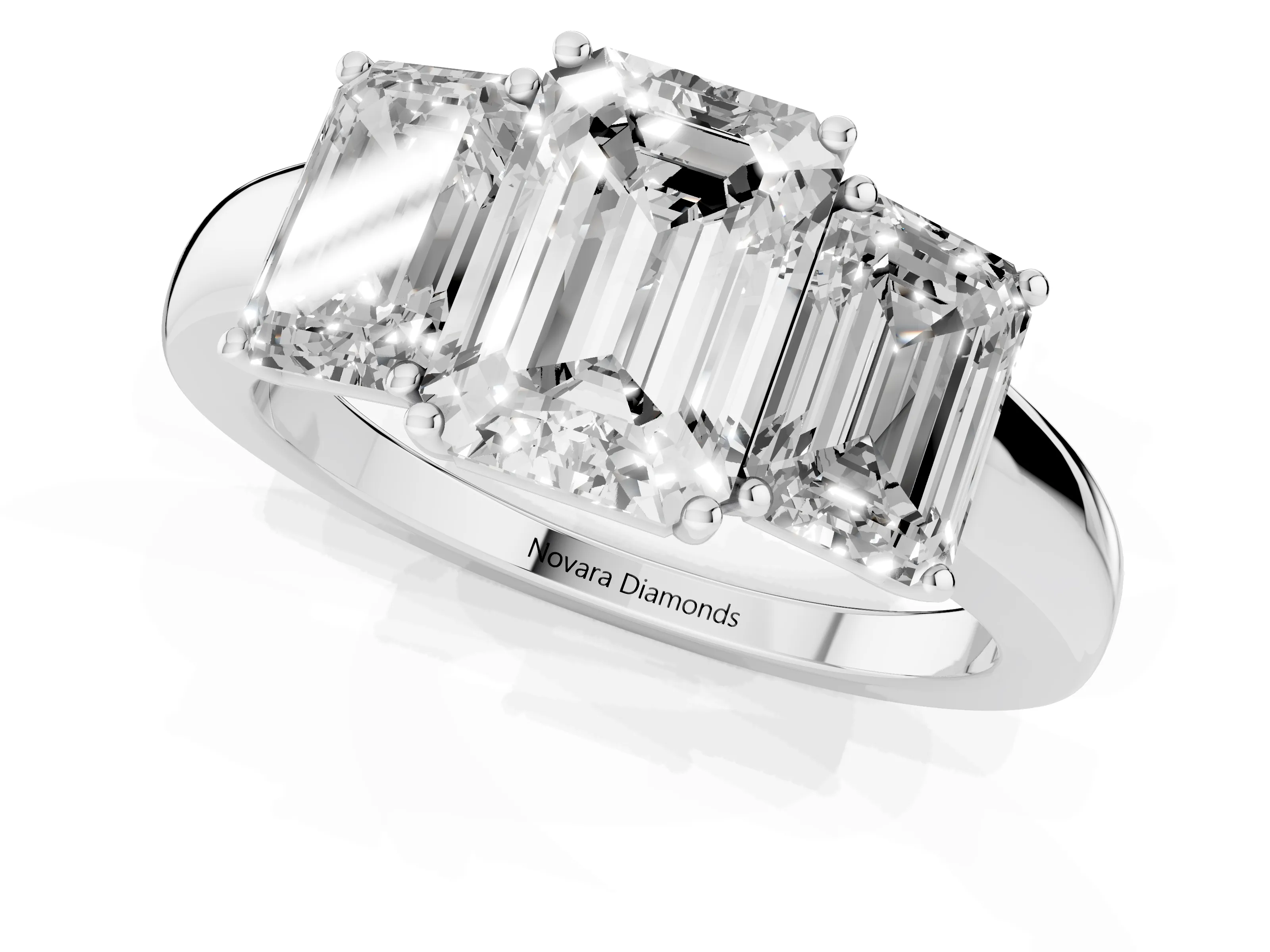 Emerald Cut Diamond Three-Stone Ring Set in Platinum with Bold Center and Classic Band