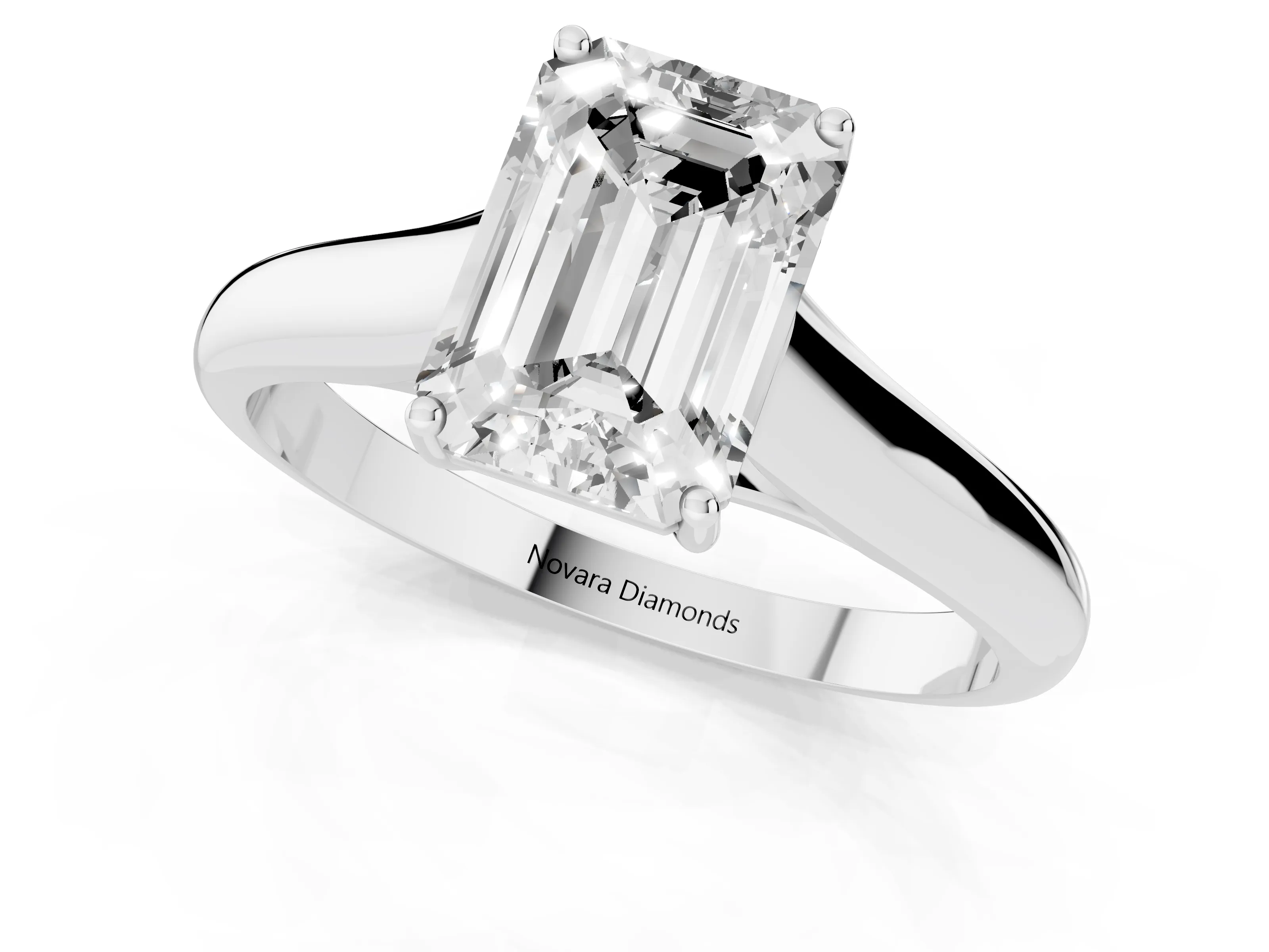 Emerald Cut Diamond Solitaire Engagement Ring Set in White gold with Subtly Tapered Band and Prong Setting