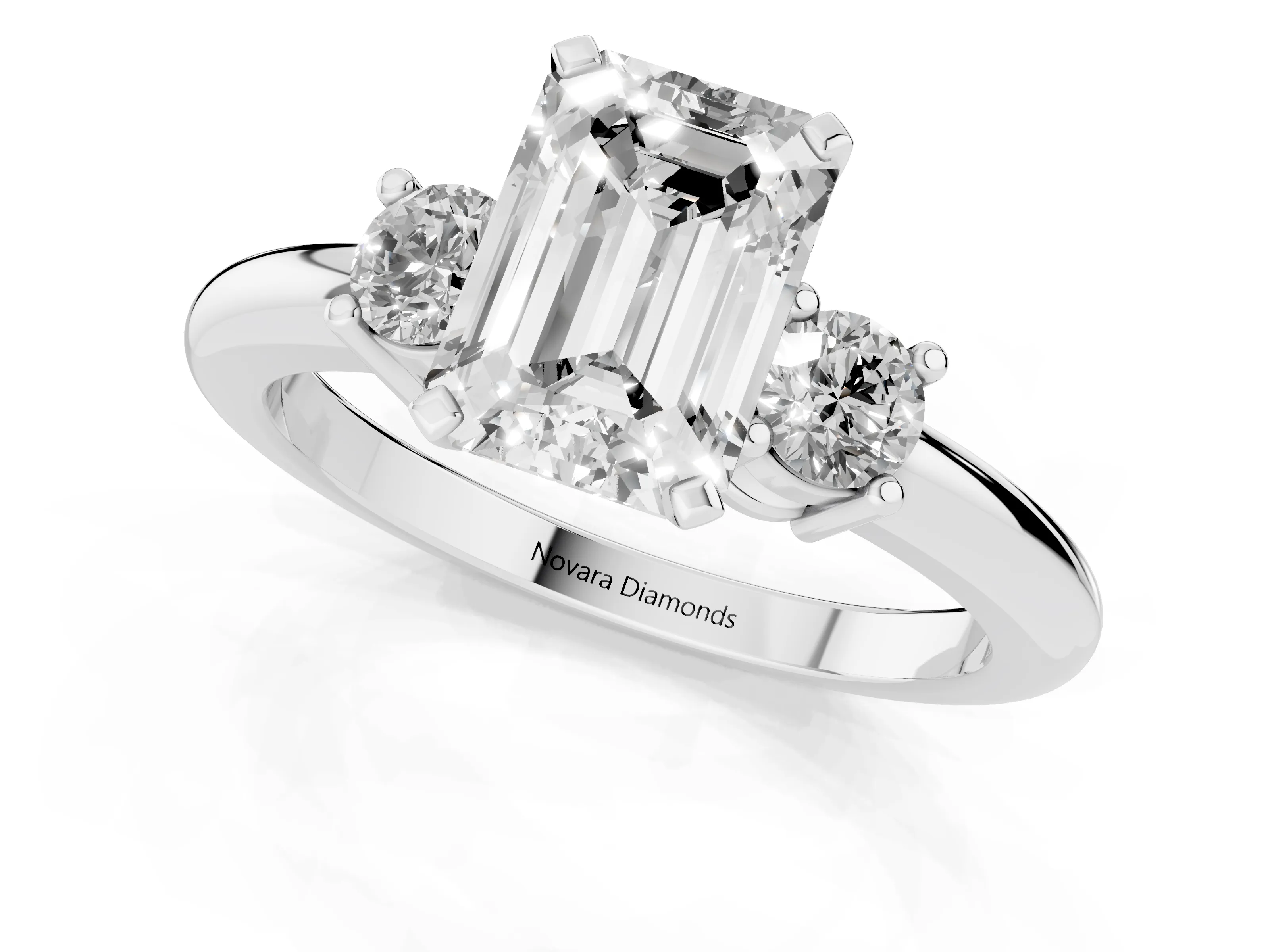 Three-Stone Emerald Cut Diamond Ring Set in Platinum with Prong Setting and Plain Band