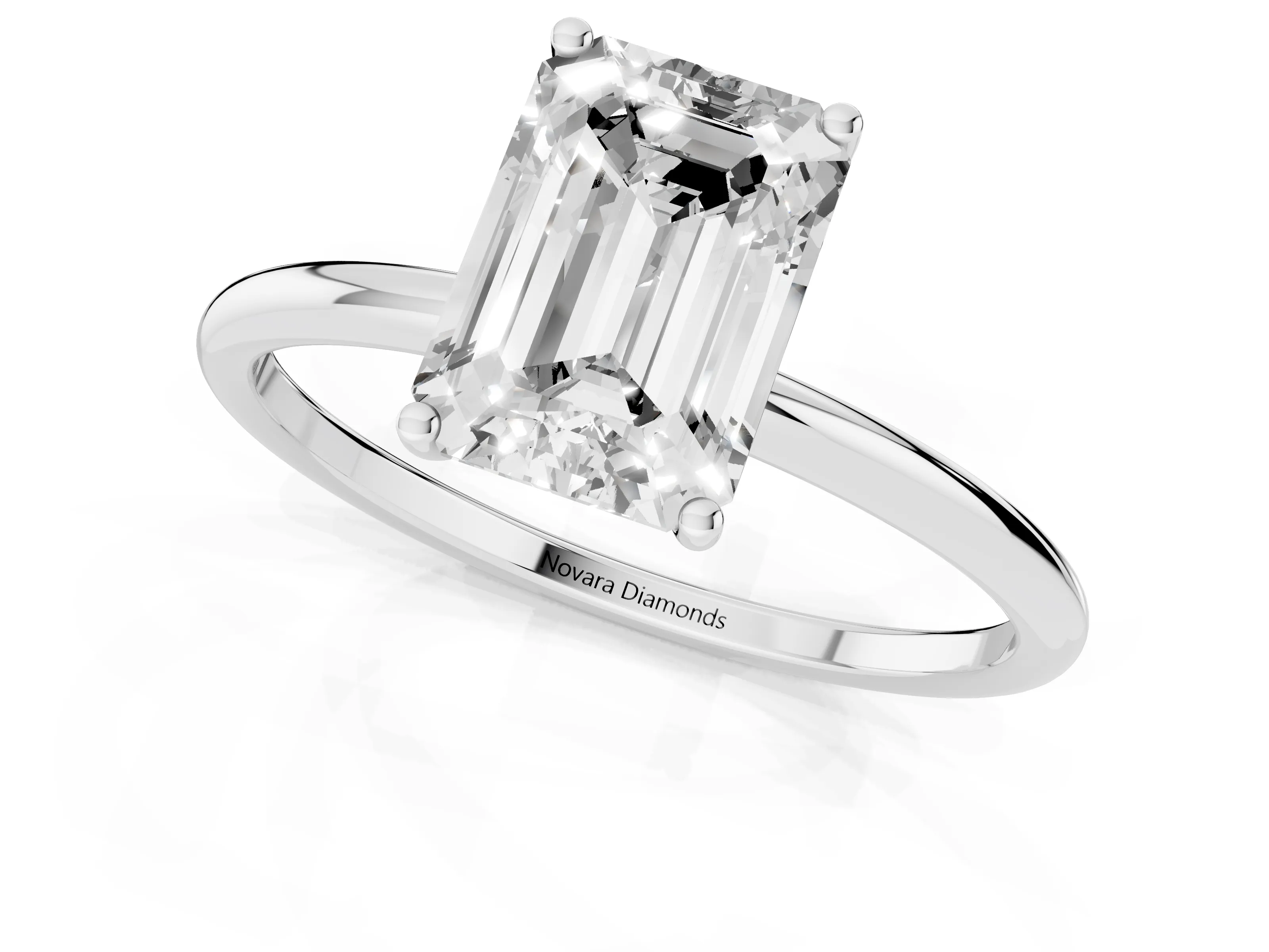 Emerald Cut Diamond Solitaire Engagement Ring Set in Platinum with Thin Band and Prong Setting