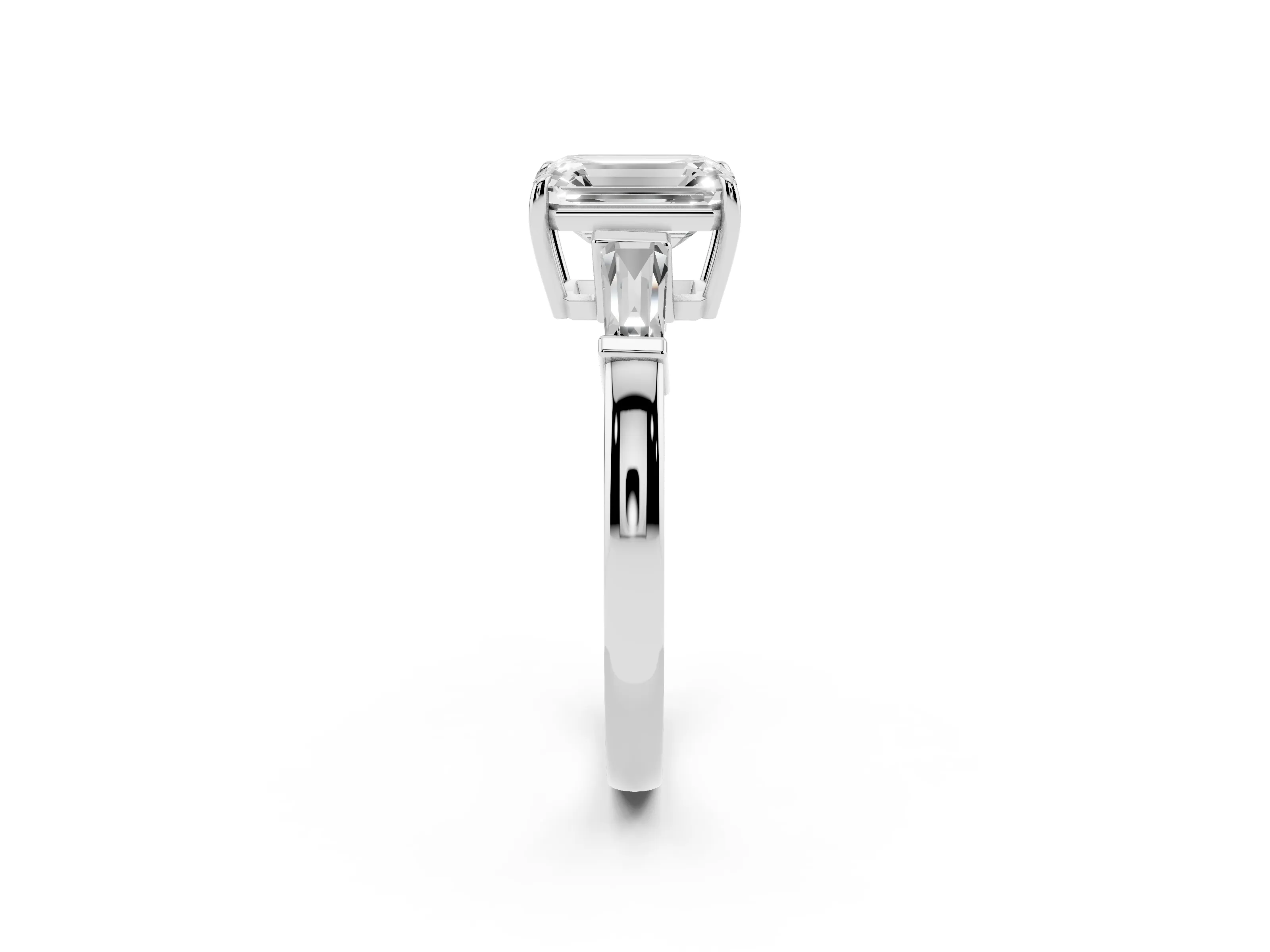 Emerald Cut Diamond Three-Stone Ring Set in Platinum with Tapered Baguette Side Stones and Prong Setting