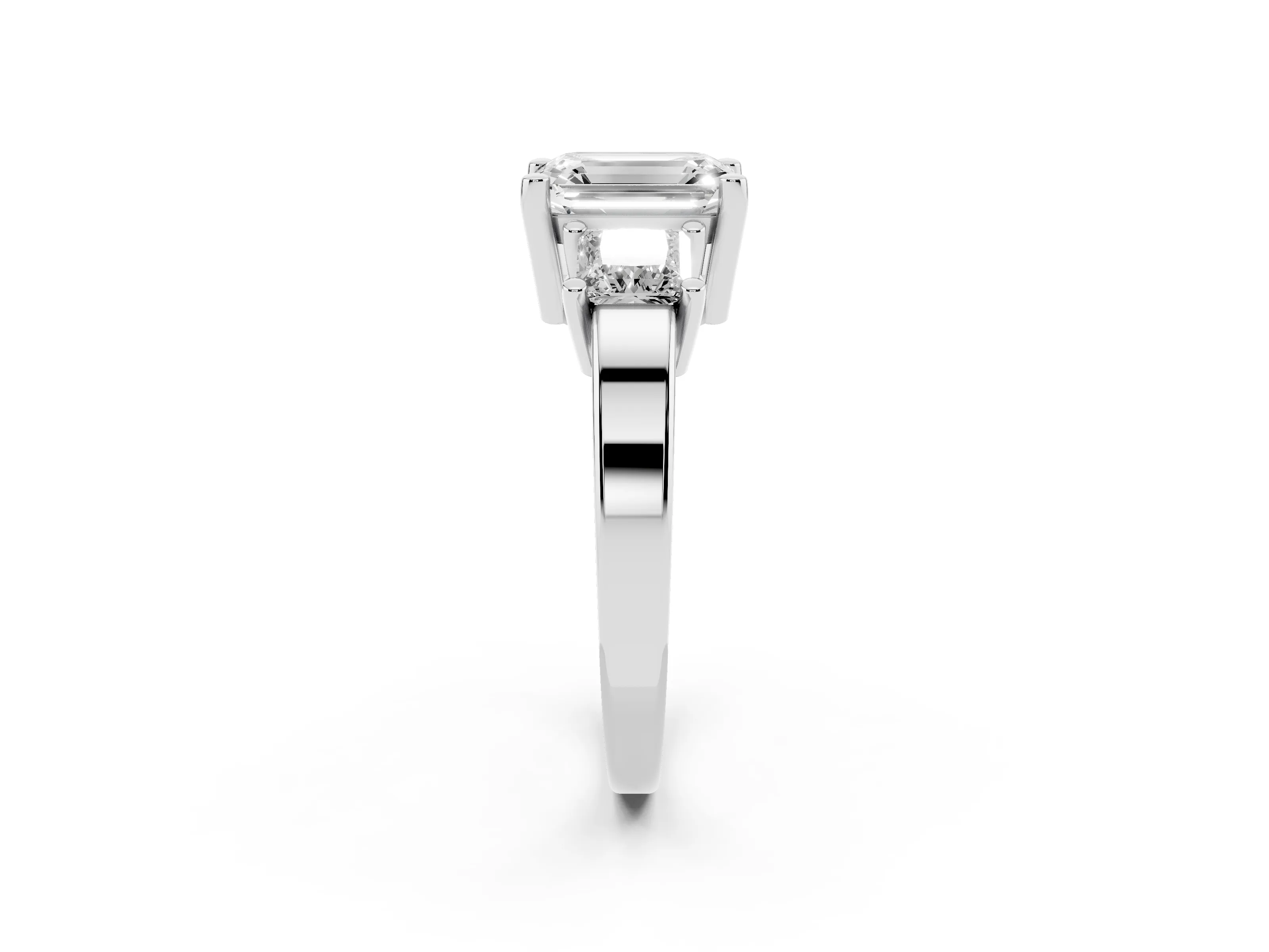 Three-Stone Emerald Cut Diamond Solitaire Ring Set in Platinum with Prong Setting