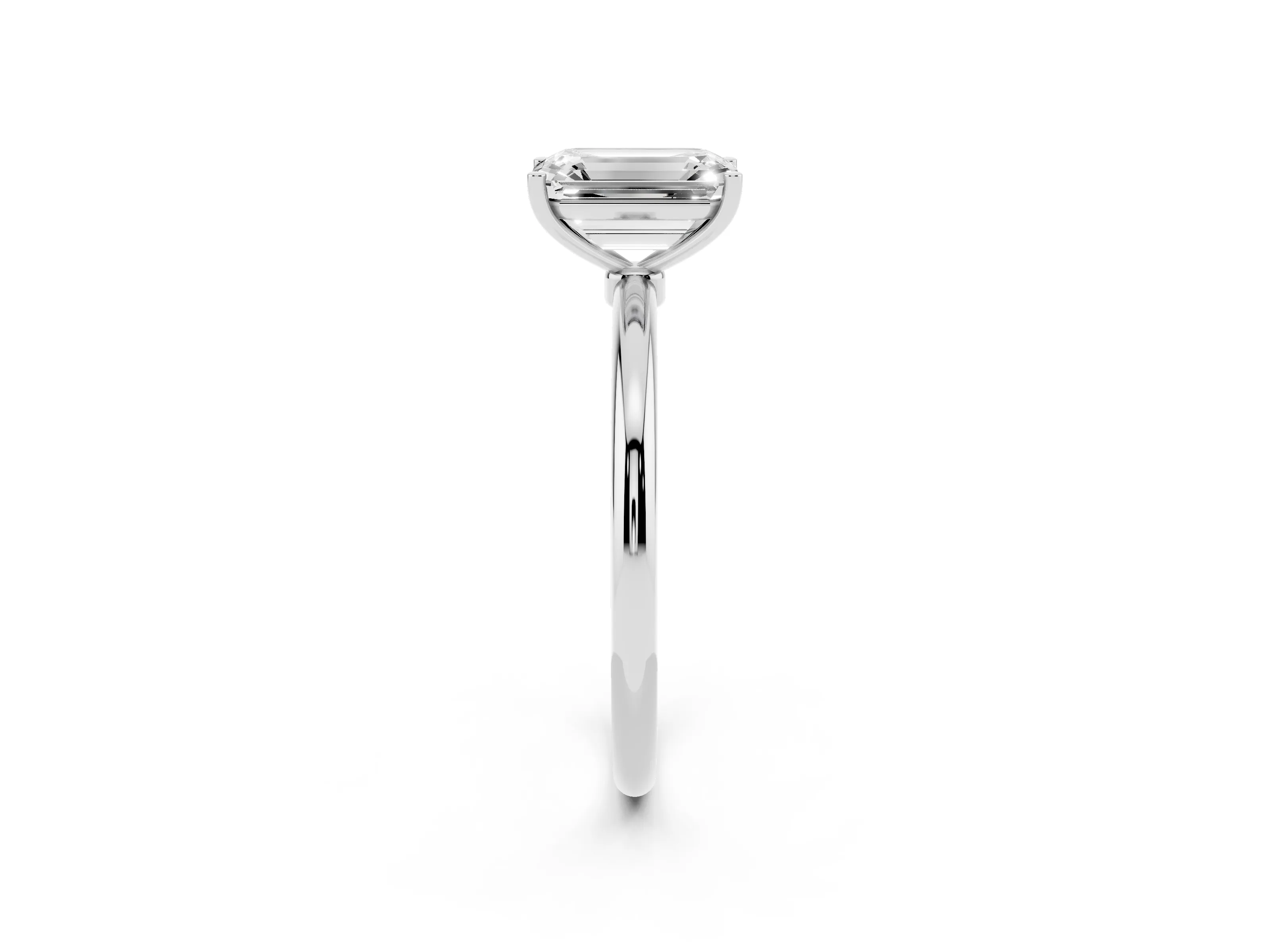 Emerald Cut Diamond Solitaire Engagement Ring Set in Platinum with Thin Band and Prong Setting