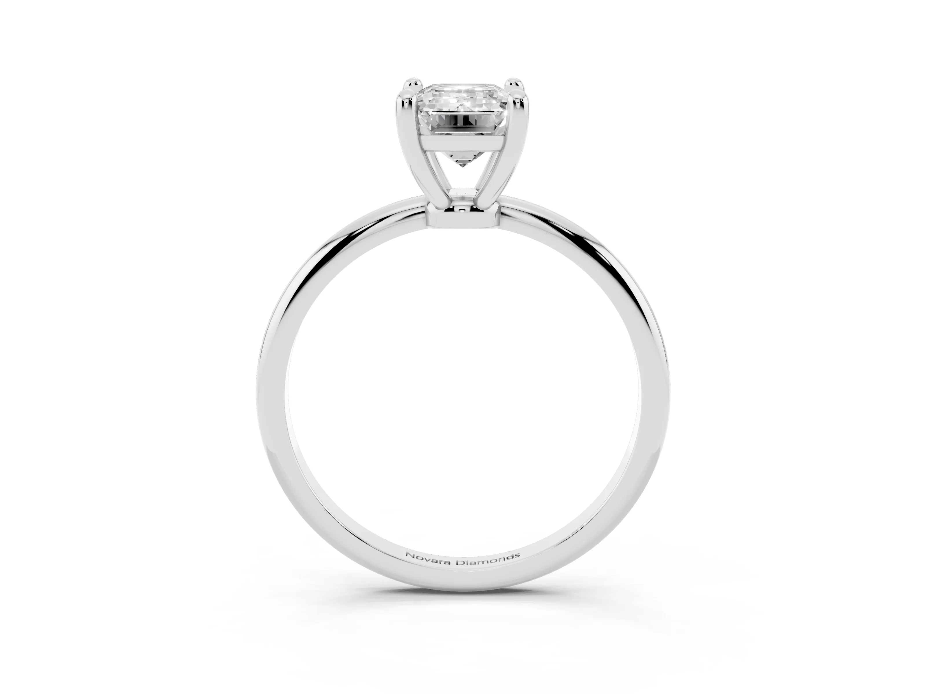 Emerald Cut Diamond Solitaire Ring Set in Silver with Secure Prong Setting on a Classic Band