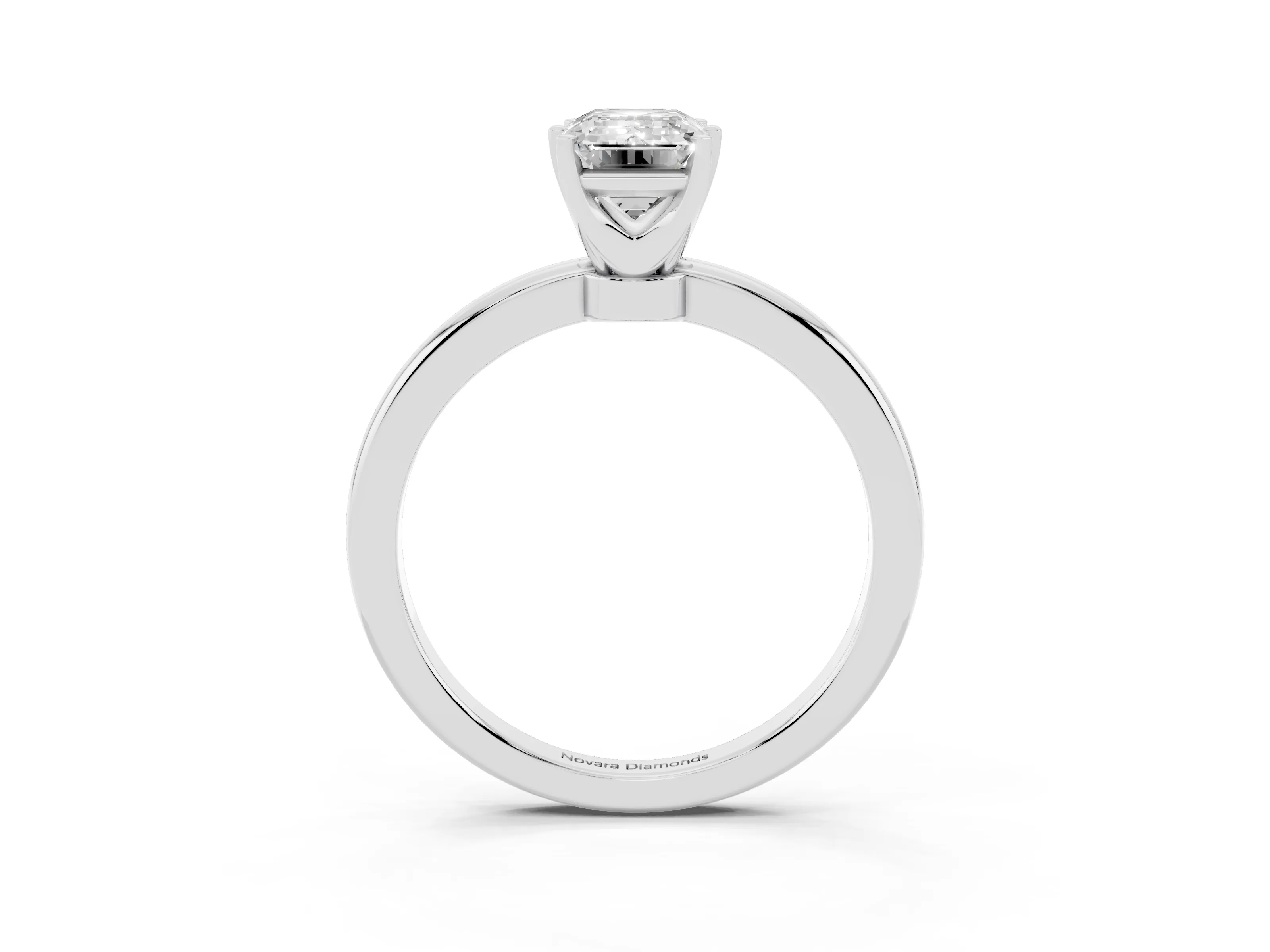 Emerald Cut Diamond Solitaire Ring Set in White gold with Raised Prong Setting on a Classic Band