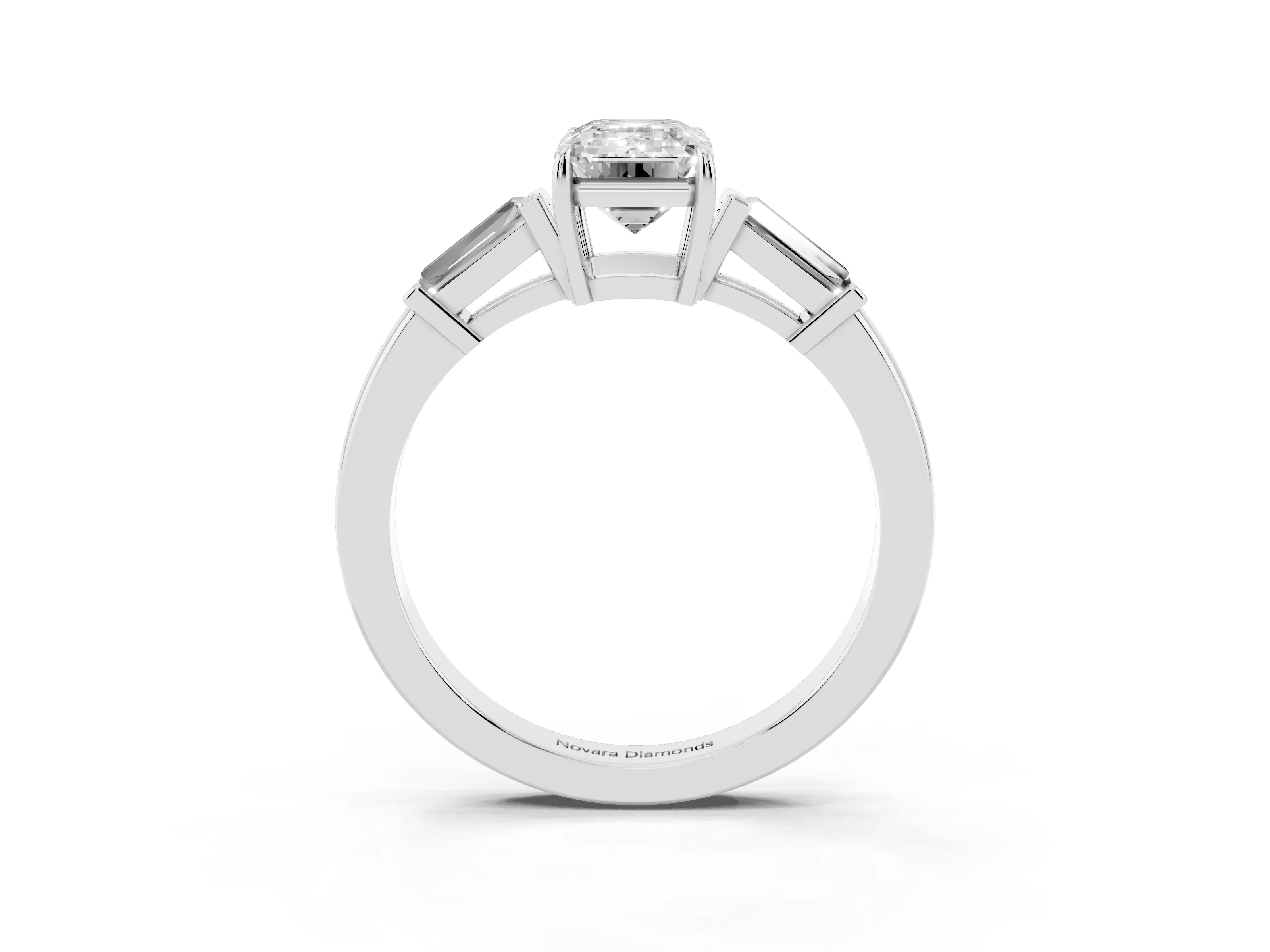 Emerald Cut Diamond Three-Stone Ring Set in Platinum with Tapered Baguette Side Stones and Prong Setting