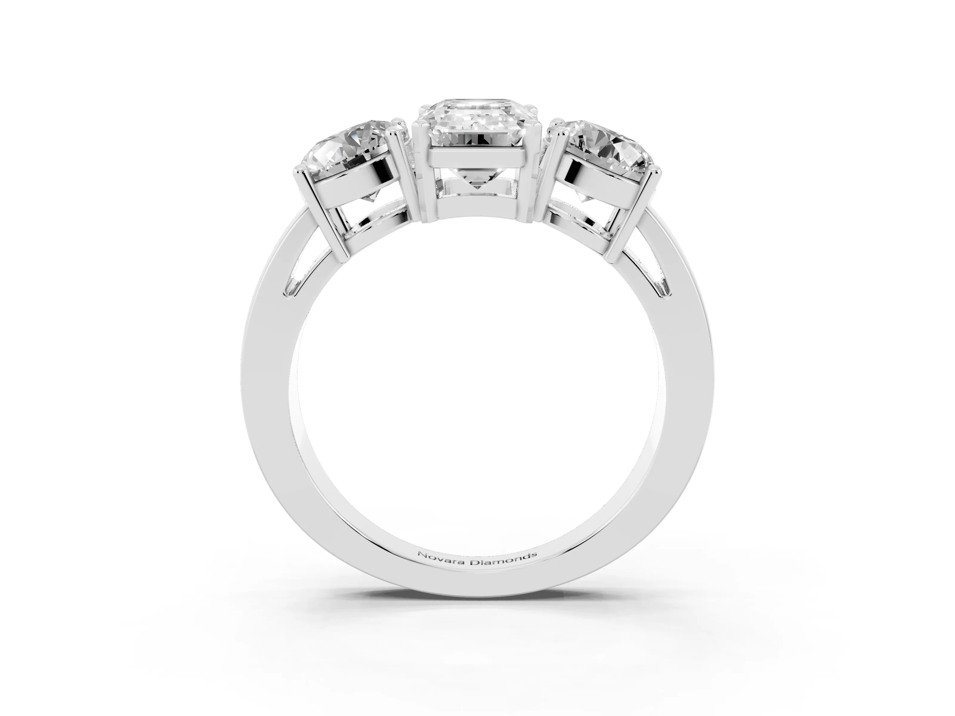 Emerald Cut Diamond Three-Stone Ring Set in White gold with Round Side Stones and Classic Band