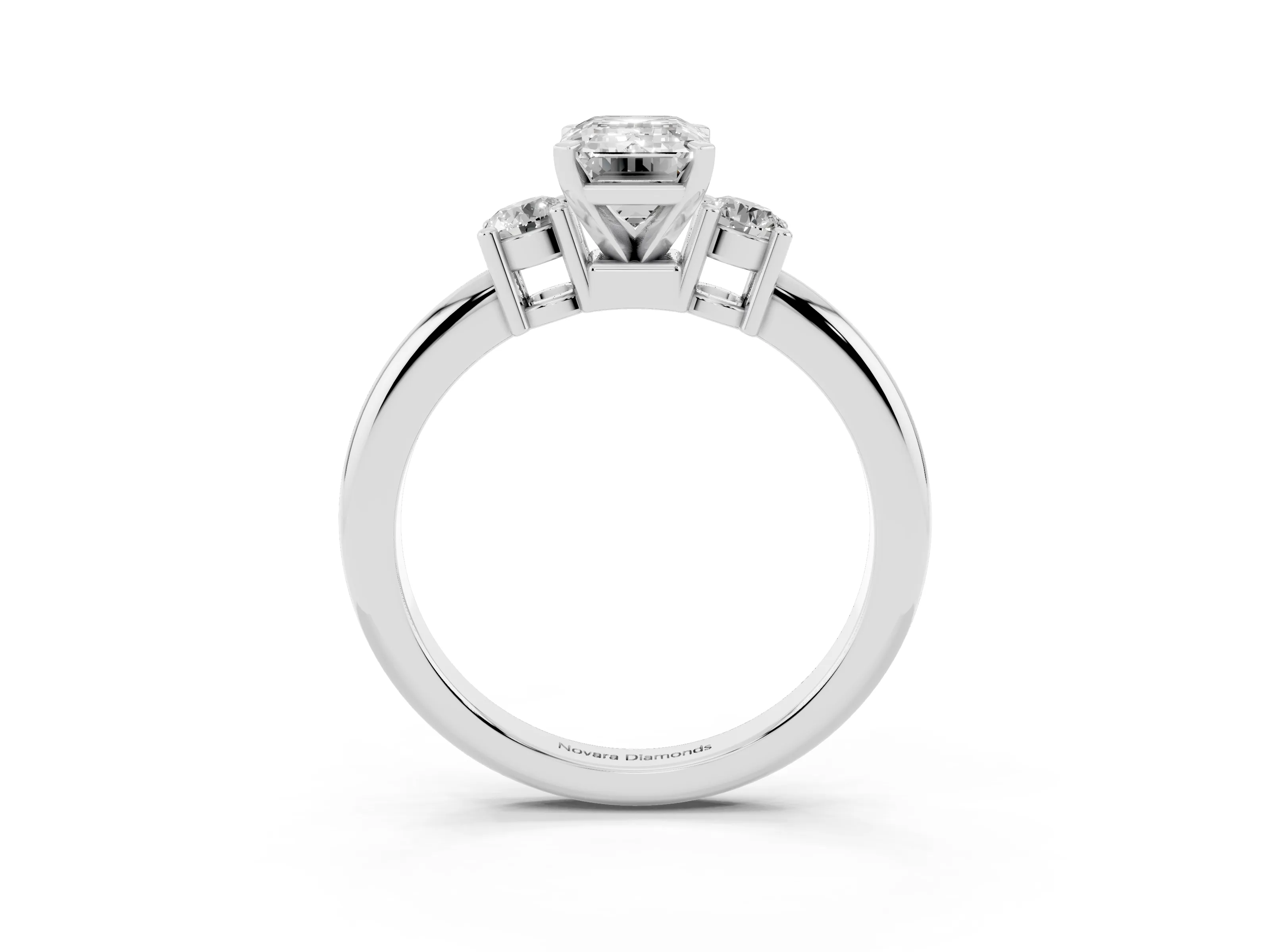 Three-Stone Emerald Cut Diamond Ring Set in Platinum with Prong Setting and Plain Band