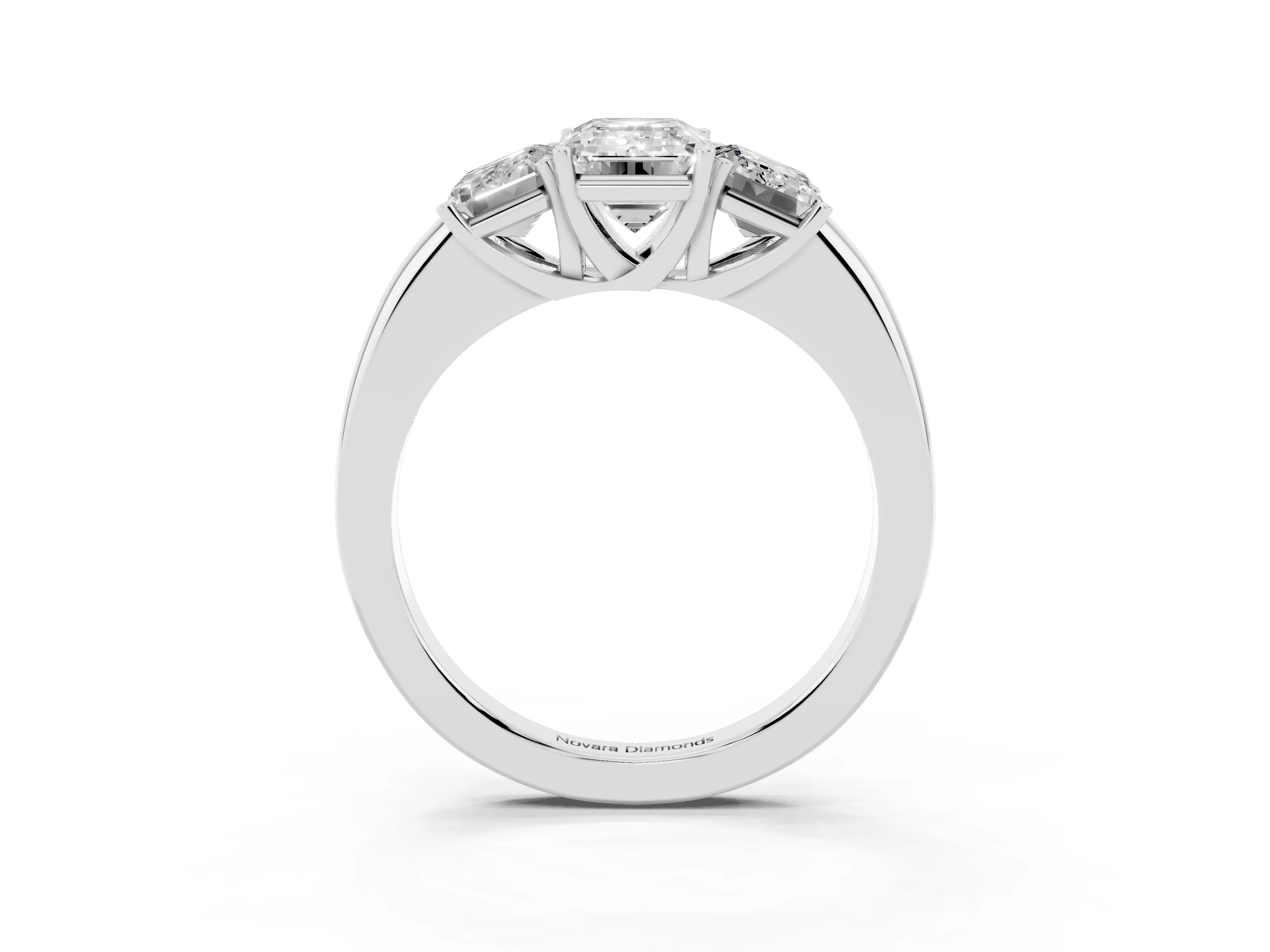 Emerald Cut Diamond Three-Stone Ring Set in Platinum with Bold Center and Classic Band