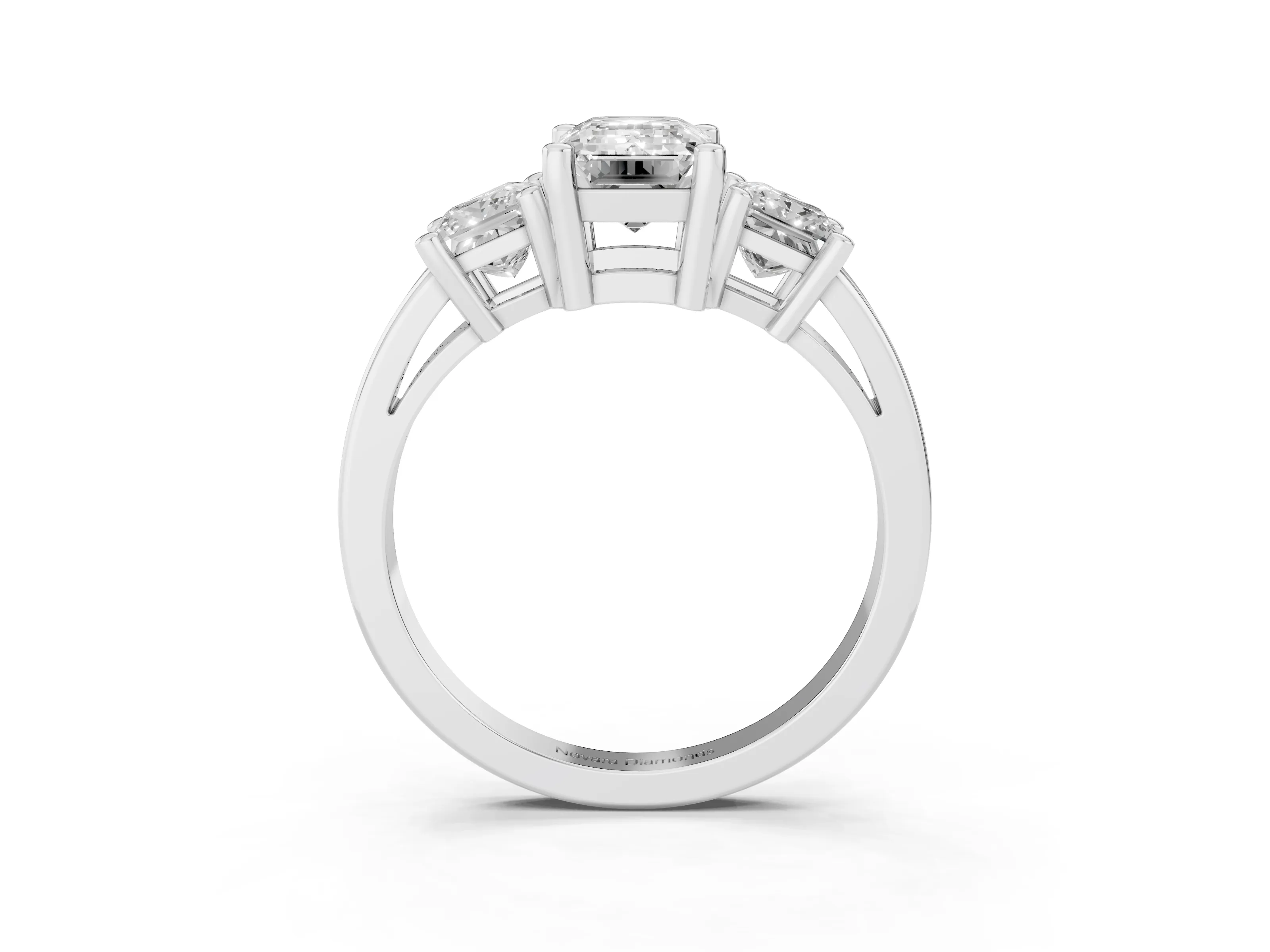 Three-Stone Emerald Cut Diamond Solitaire Ring Set in Platinum with Prong Setting