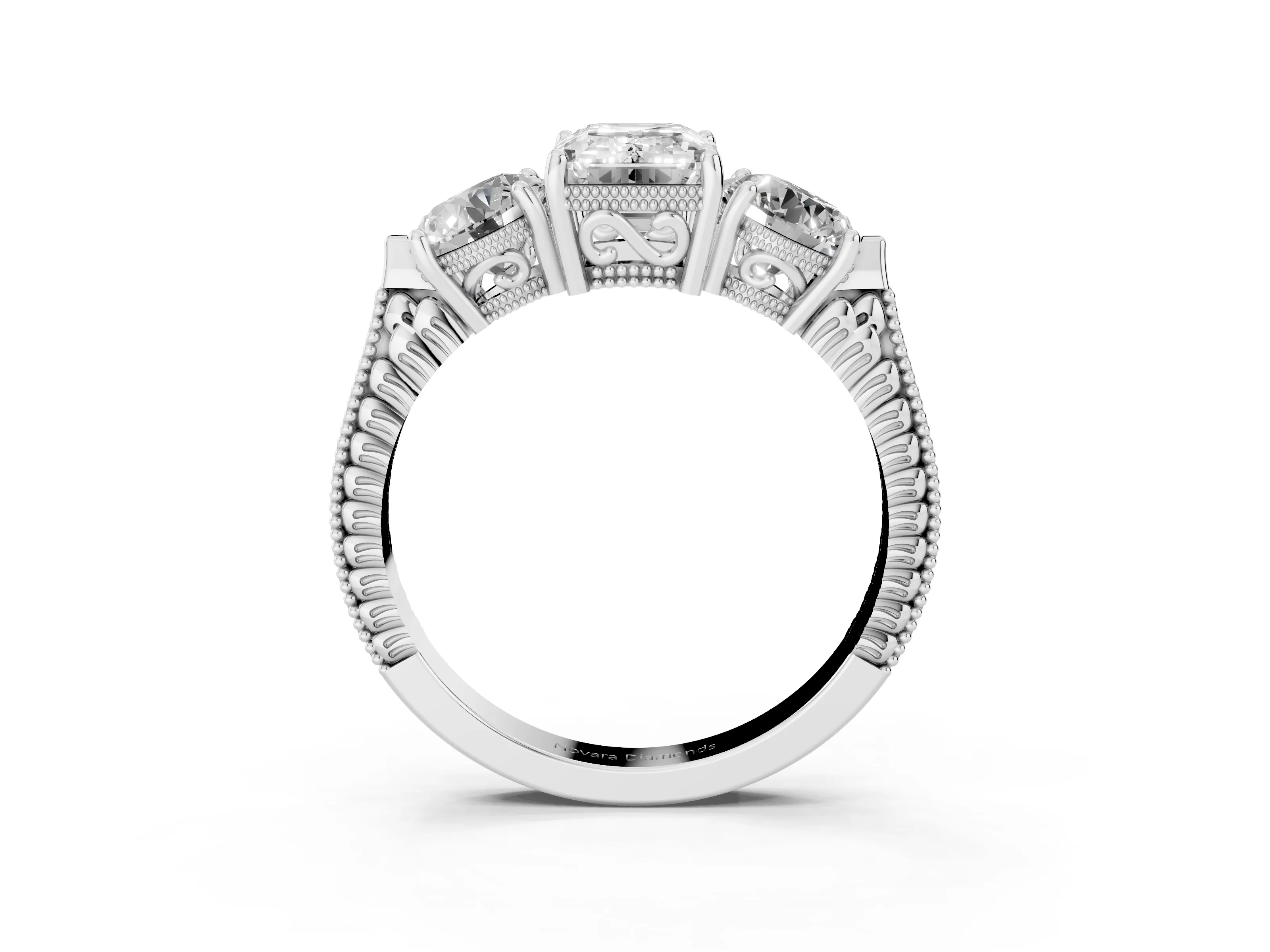 Emerald Cut Diamond Three-Stone Ring Set in Platinum with Milgrain Band