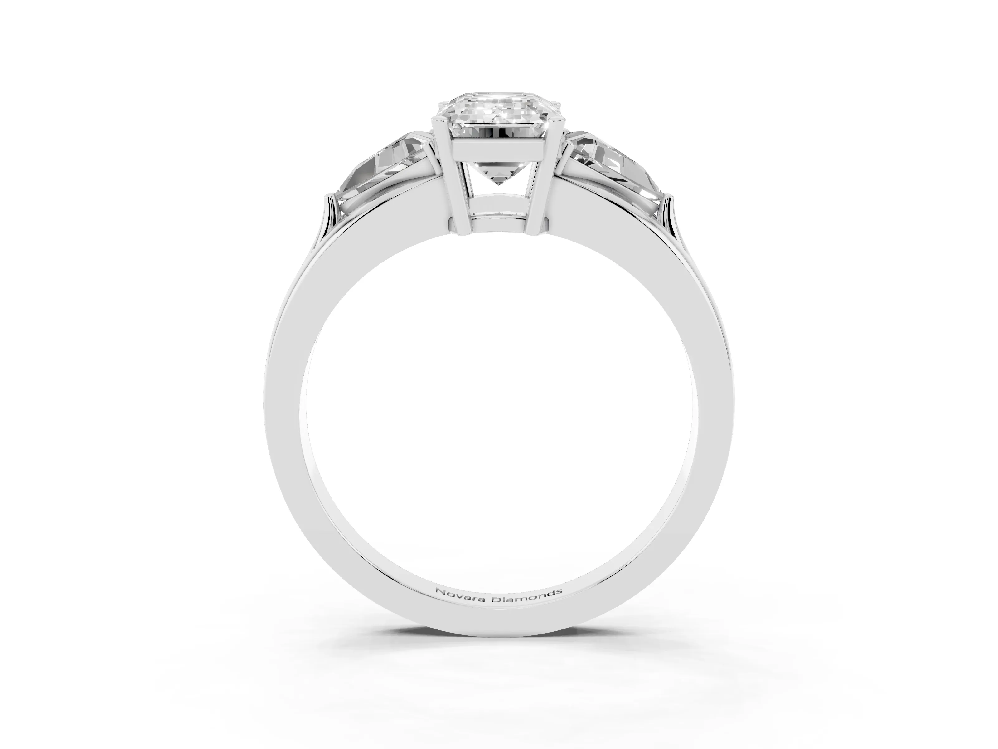Emerald Cut Diamond Three-Stone Ring Set in Platinum with Trillion Side Stones and Split Shank
