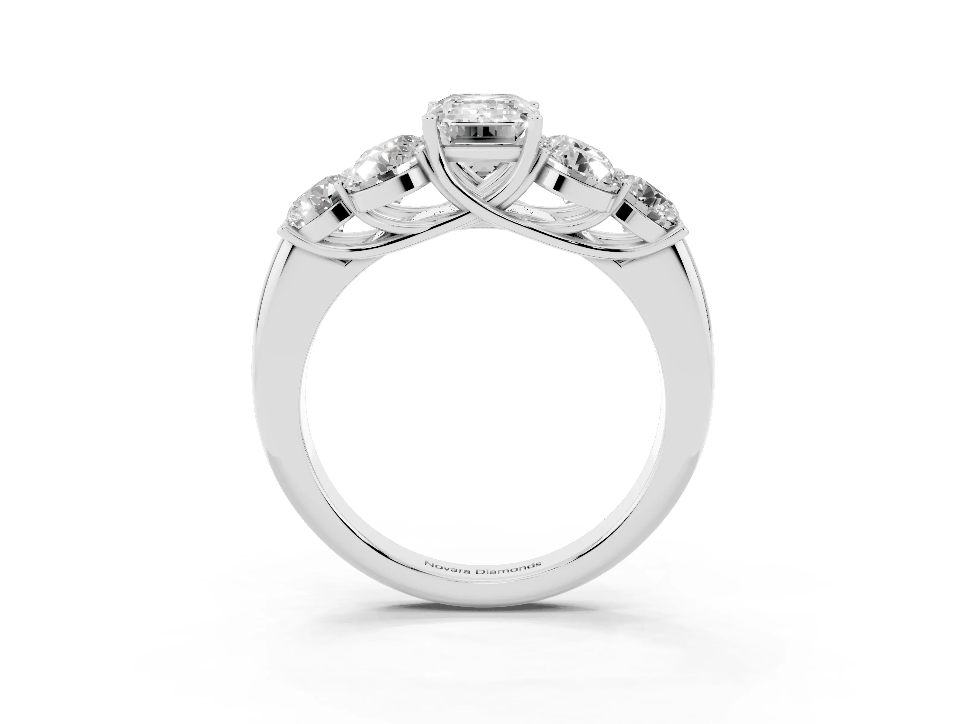 Emerald Cut Diamond Cluster Ring Set in Platinum with Round Accent Stones and Prong Setting on a Plain Band