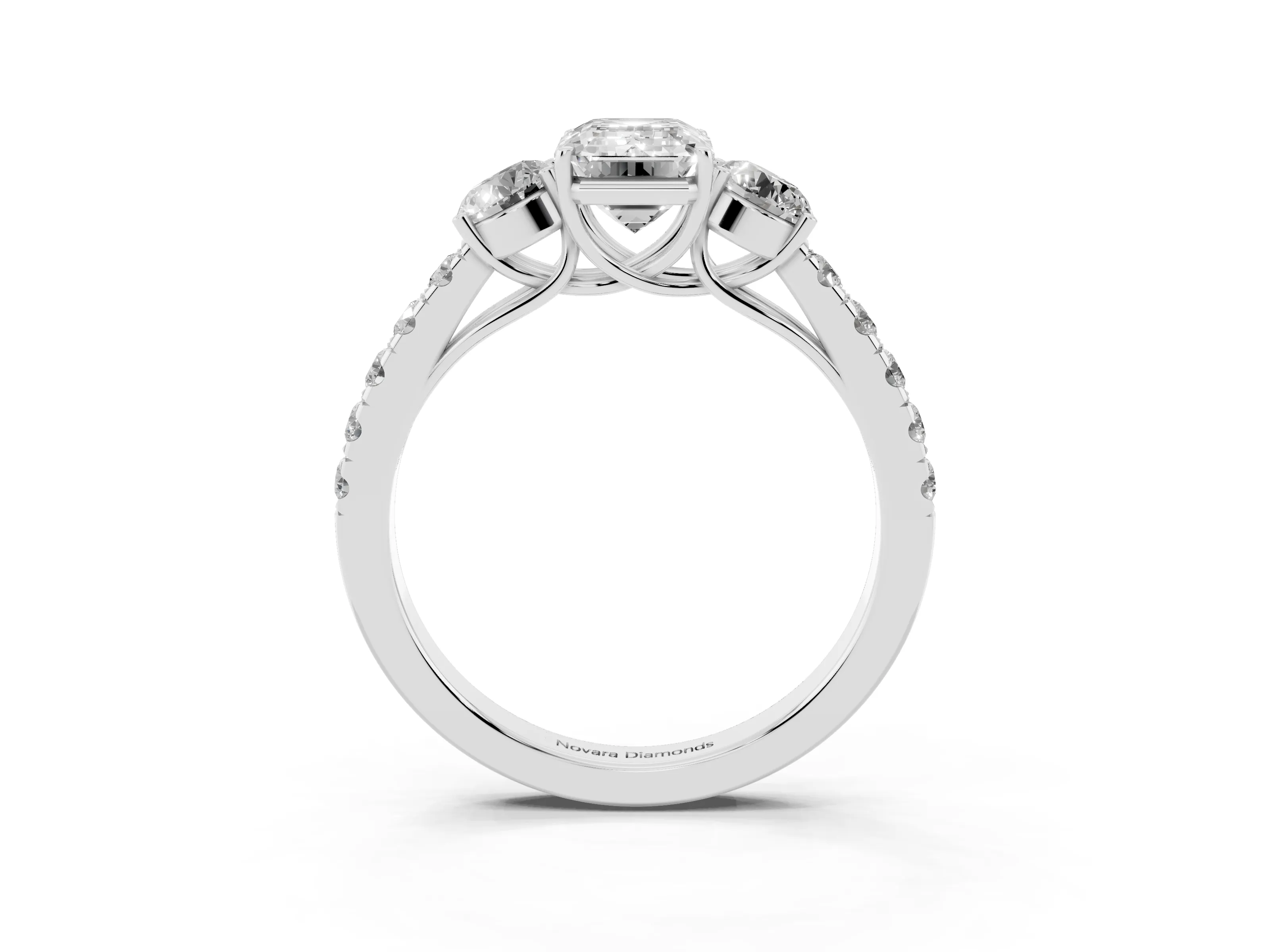 Emerald Cut Diamond Three-Stone Ring Set in White gold with Round Side Stones and Delicate Pavé Band