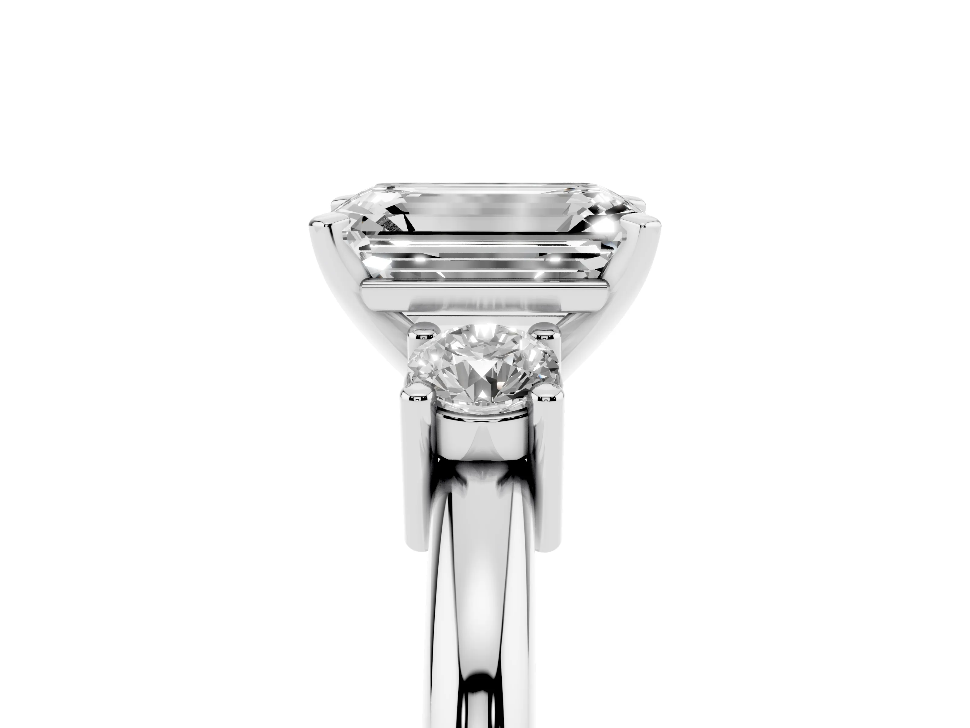 Three-Stone Emerald Cut Diamond Ring Set in Platinum with Prong Setting and Plain Band